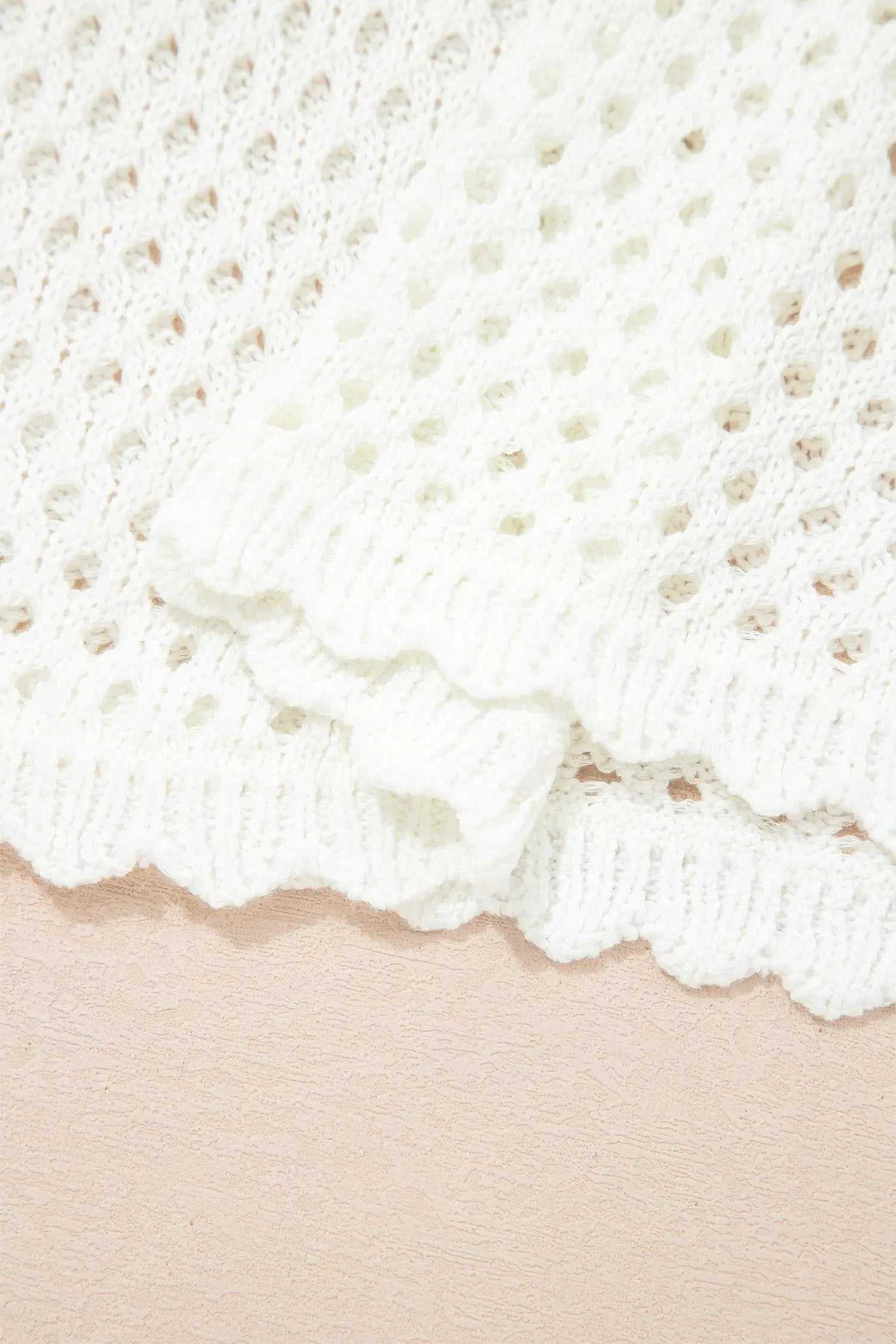 Hollow Out Knit Top with scalloped trim and long sleeves