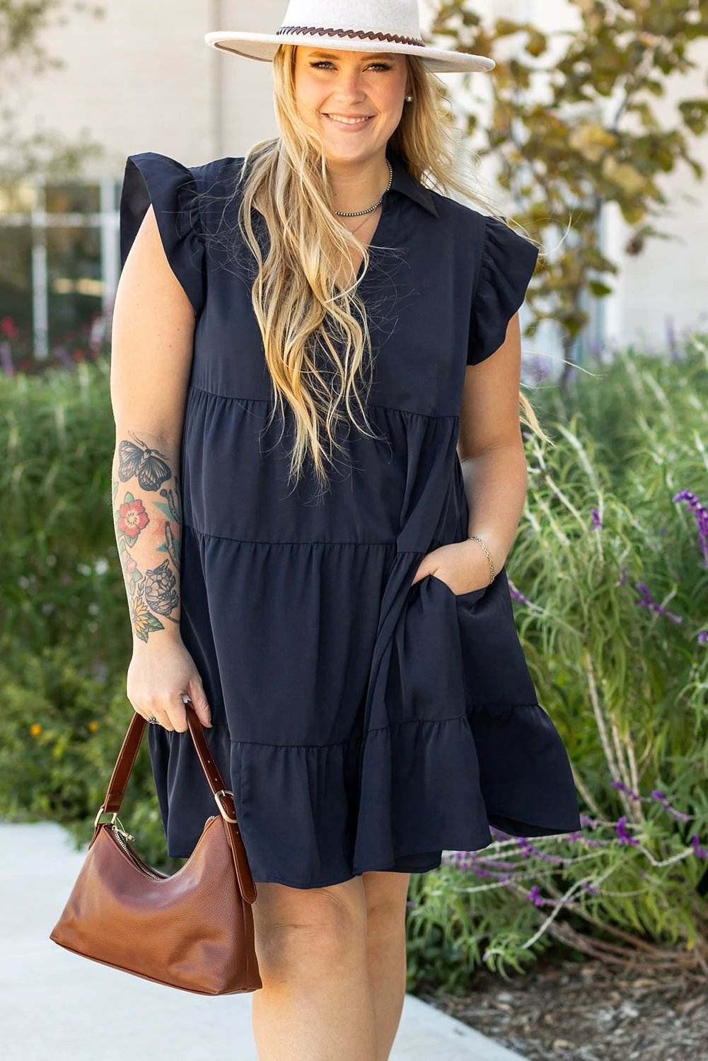 Plus size collared V-neck dress with flutter sleeves and tiered skirt in solid navy