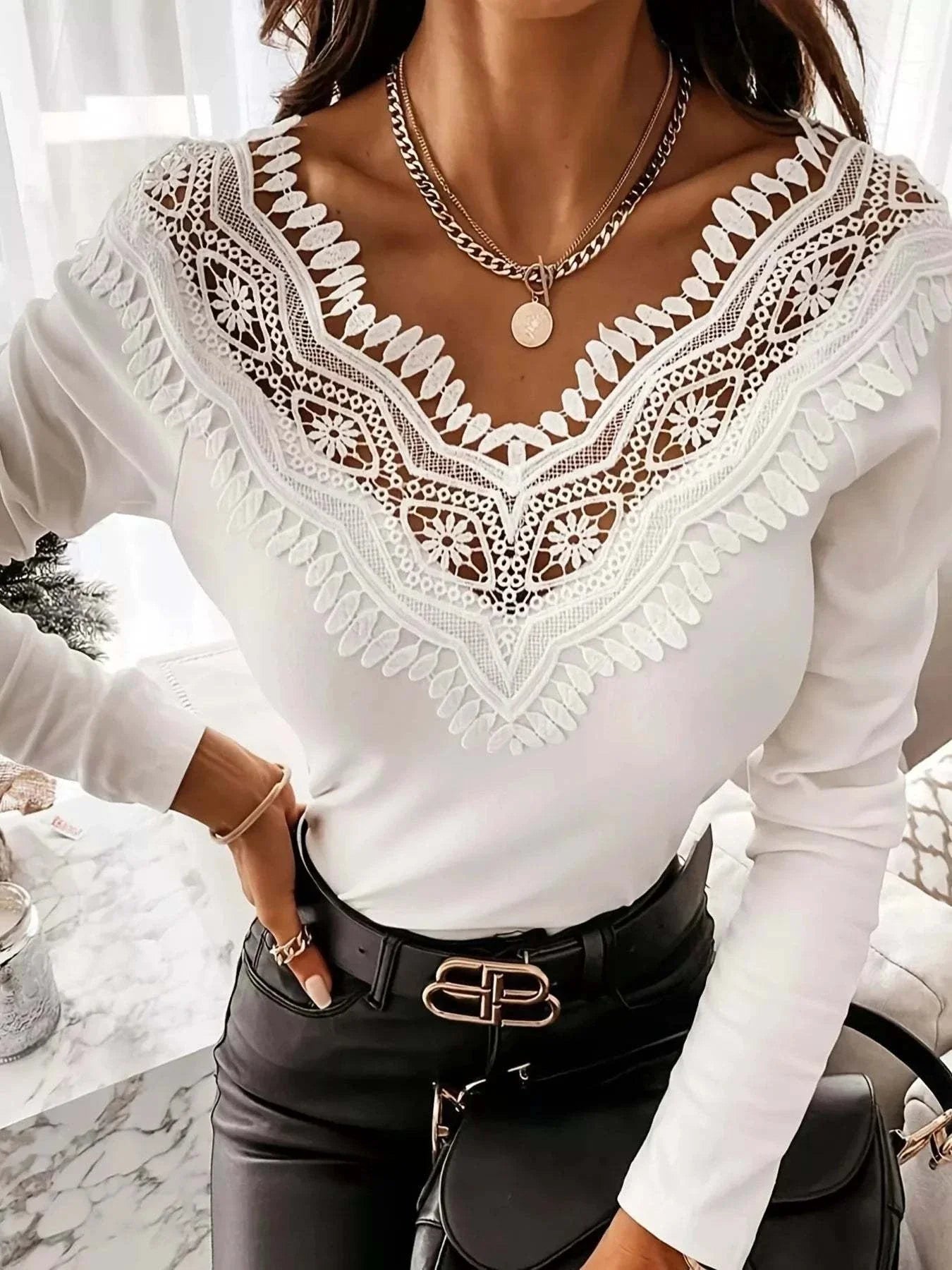 Woman wearing lace trim long sleeve tee with delicate eyelet detailing and soft-knit fabric