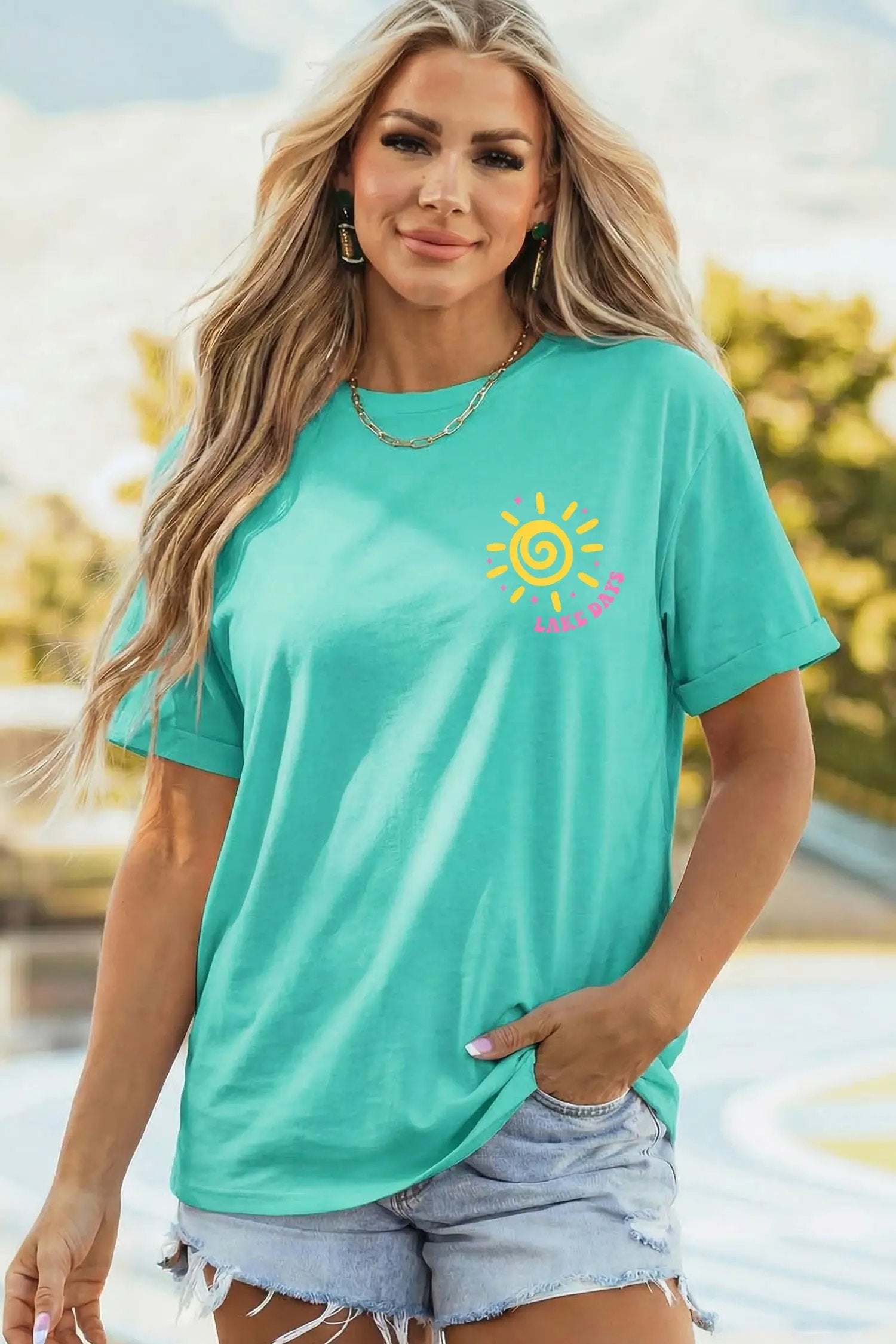 Lake Days double-sided printed graphic tee with relaxed fit on model outdoors