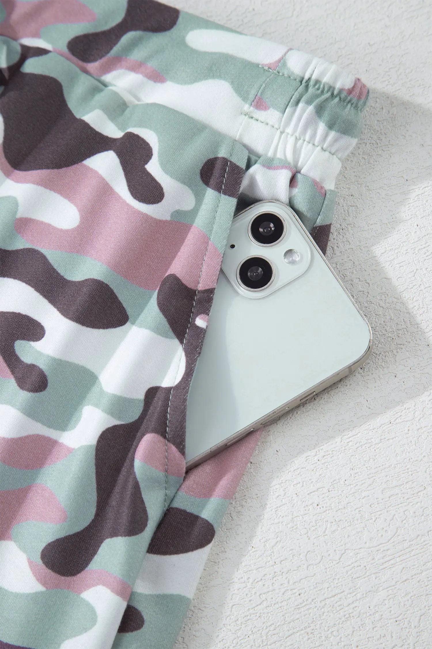 Green camouflage print drawstring mini skort with elastic waist and smooth drape