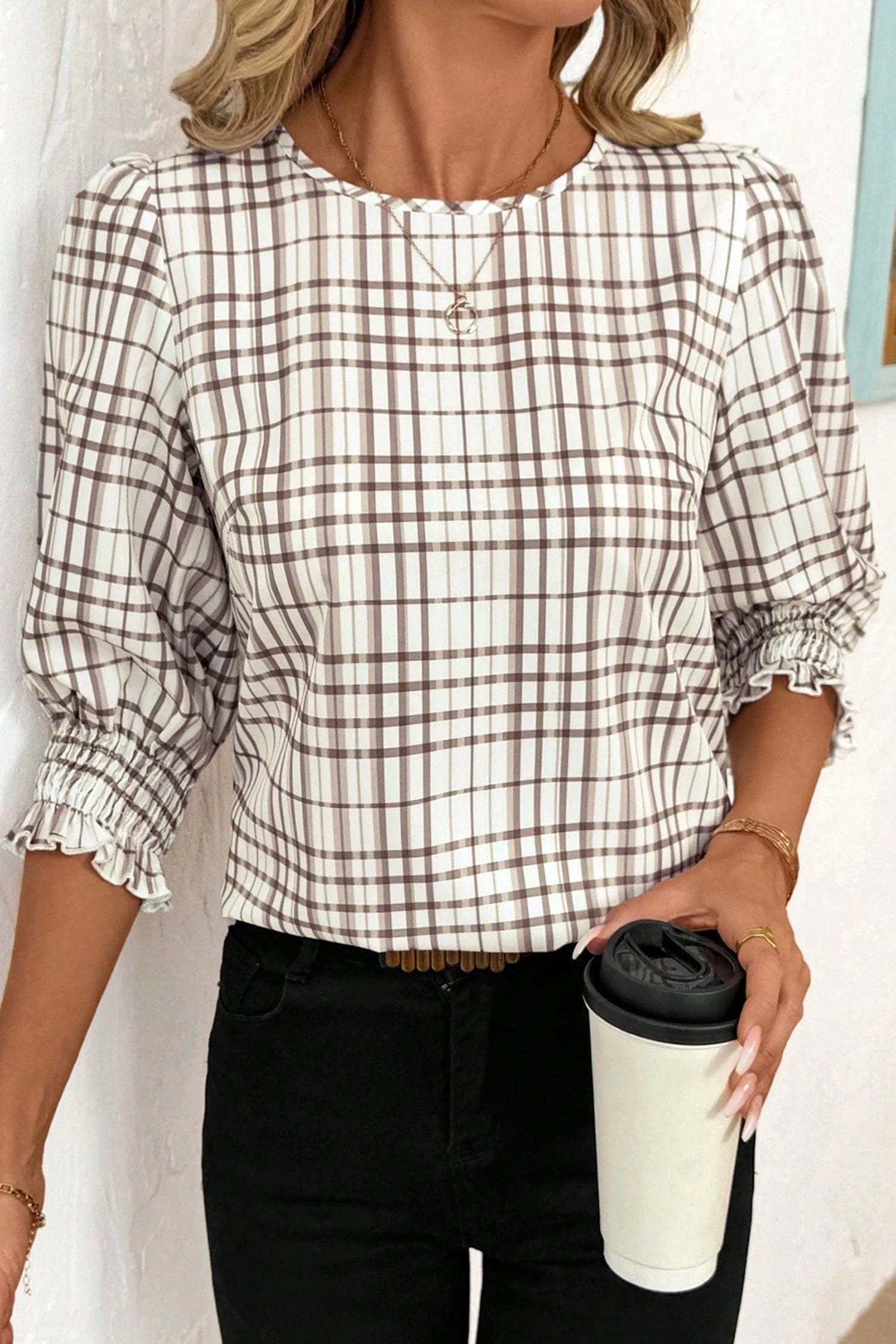 Woman wearing effortless mom chic plaid frilled puffy half sleeve blouse
