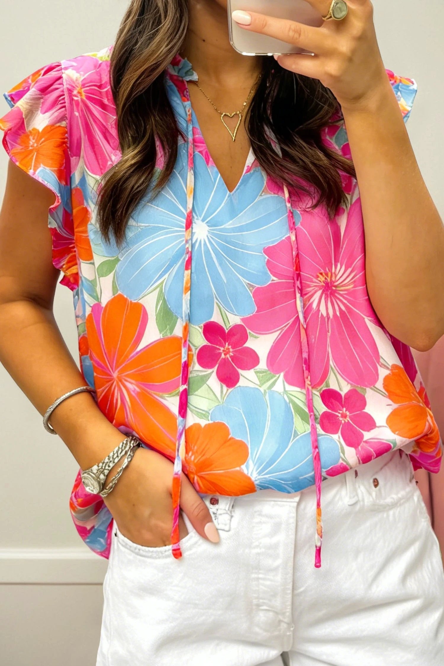 Multicolor vibrant floral tie-neck sleeveless blouse with ruffle trim