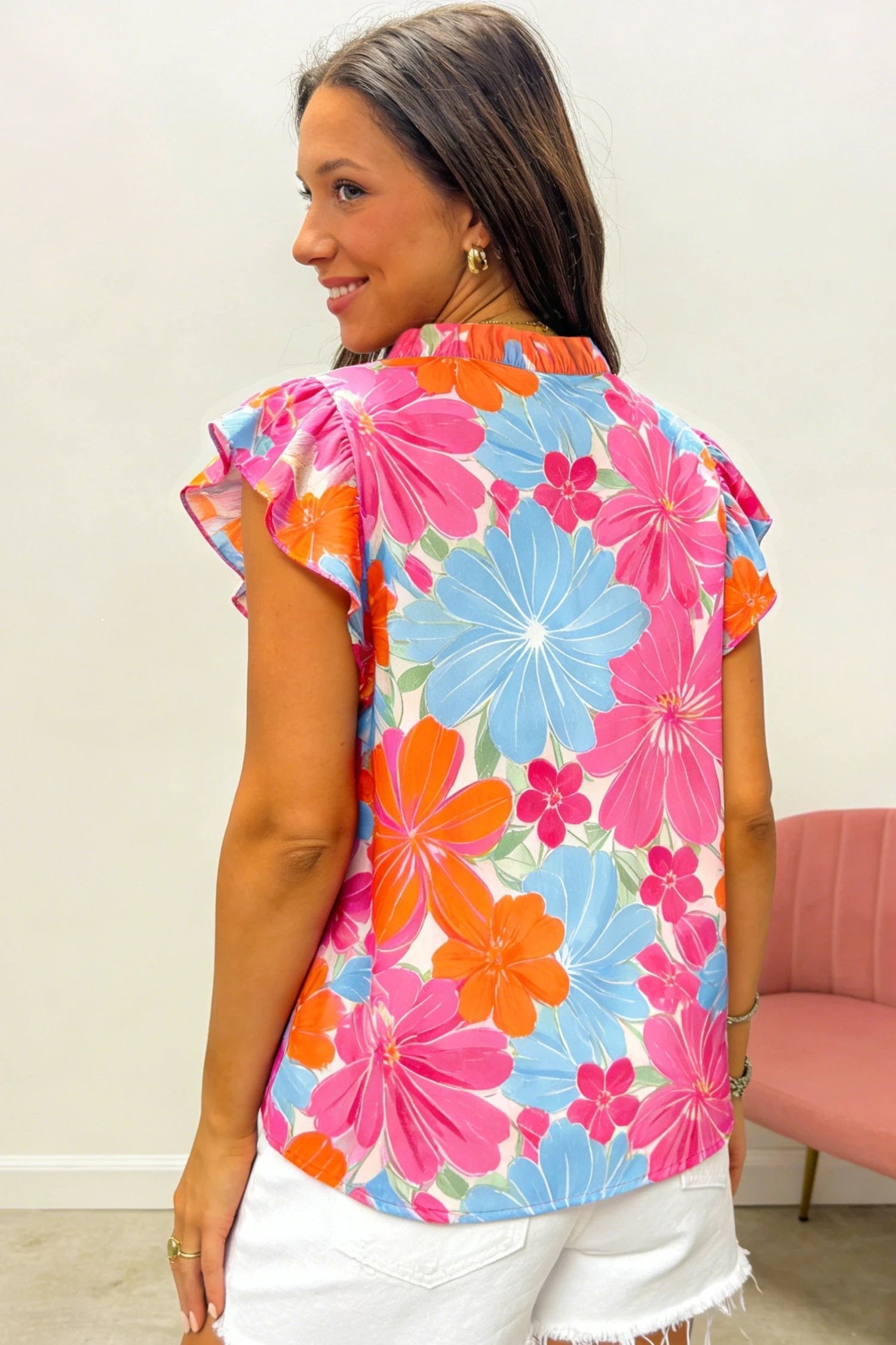 Multicolor vibrant floral tie-neck sleeveless blouse with ruffle trim