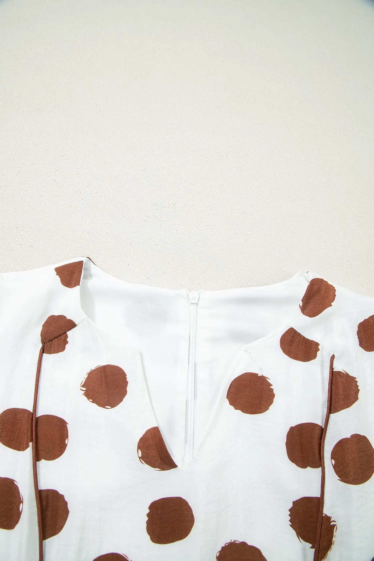 White midi dress with warm brown polka dots, V-neck, tie waist, and short puff sleeves, Polka Dot Daydream style