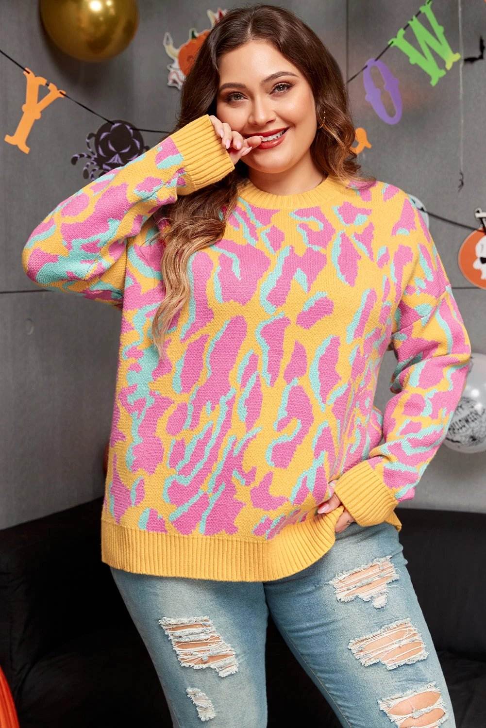 Plus size leopard print ribbed trim sweater with relaxed fit and cozy knit