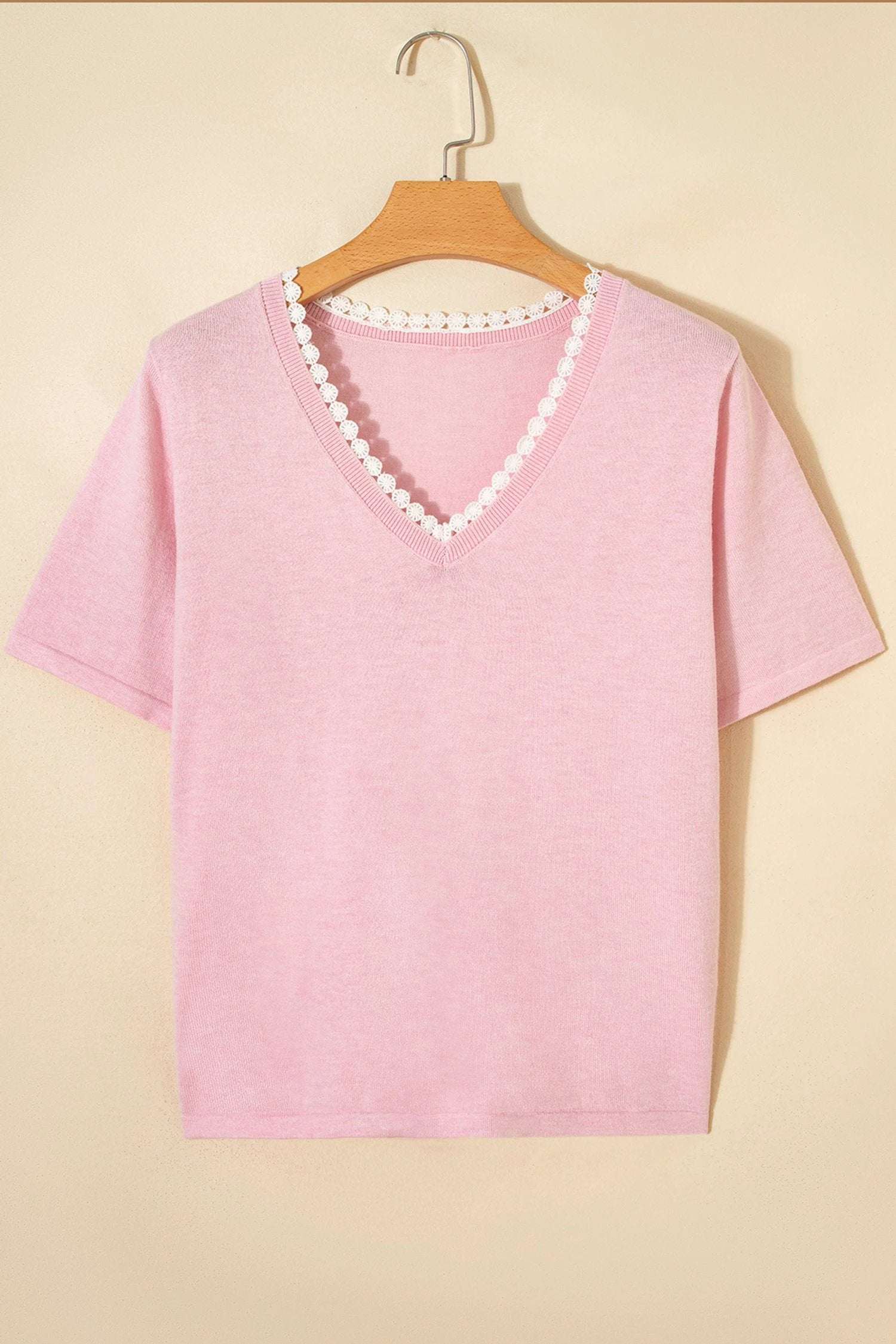 Pink knit sweater with lace trim V-neck and short sleeves, styled for casual chic mom fashion