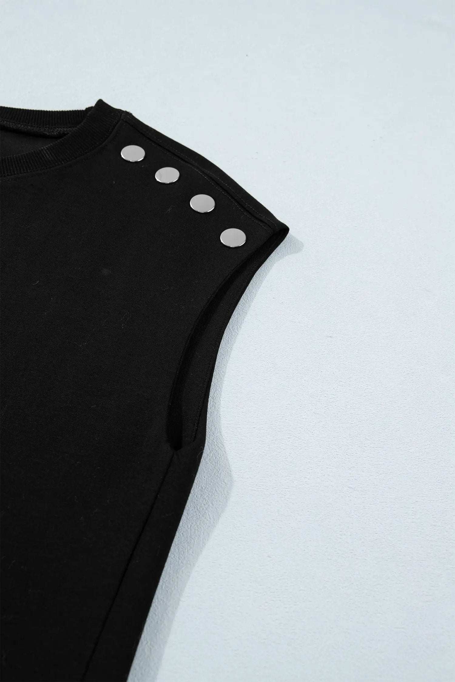 Black short sleeve top with metal button details for effortless chic mom style