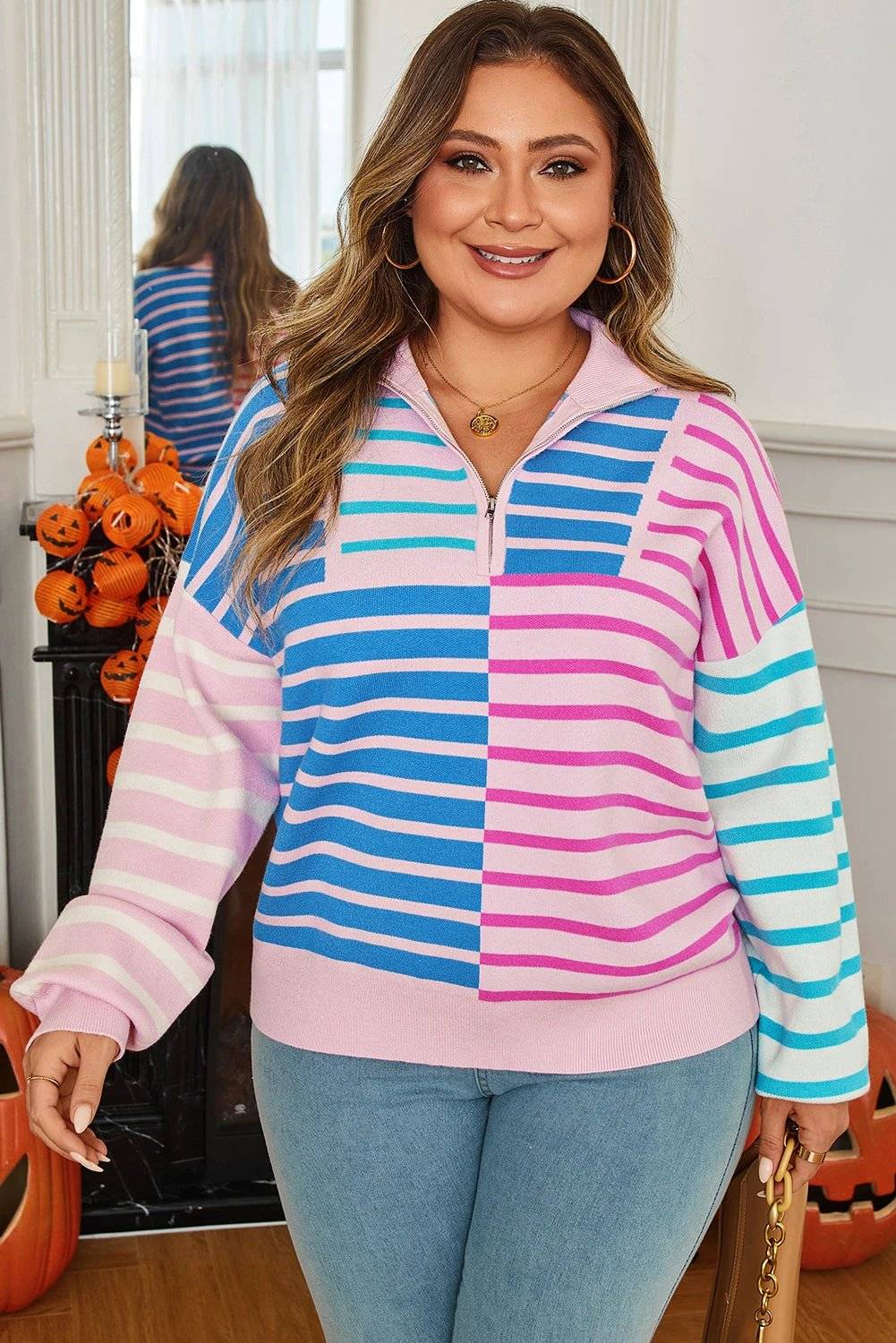 Plus size striped colorblock half zip sweater with pastel pink, blue, and white stripes and relaxed fit
