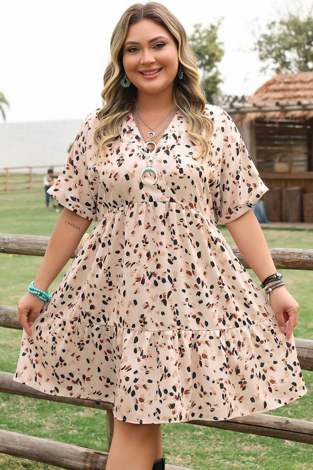 Plus size surplice floral print dress with V-neck and empire waist