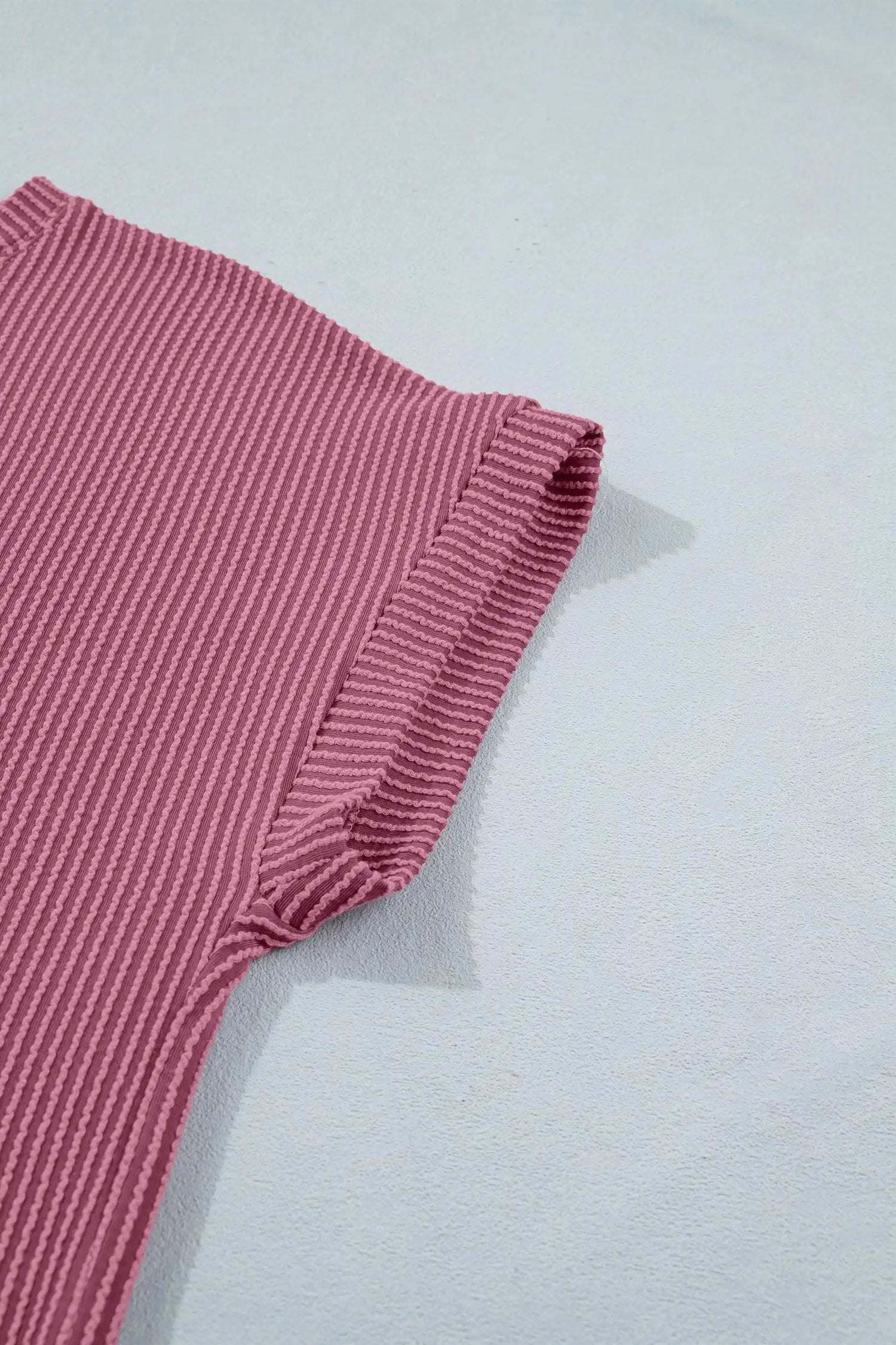Soft pink twisted ribbed two-piece set with twisted front and elastic waist shorts for casual mom style