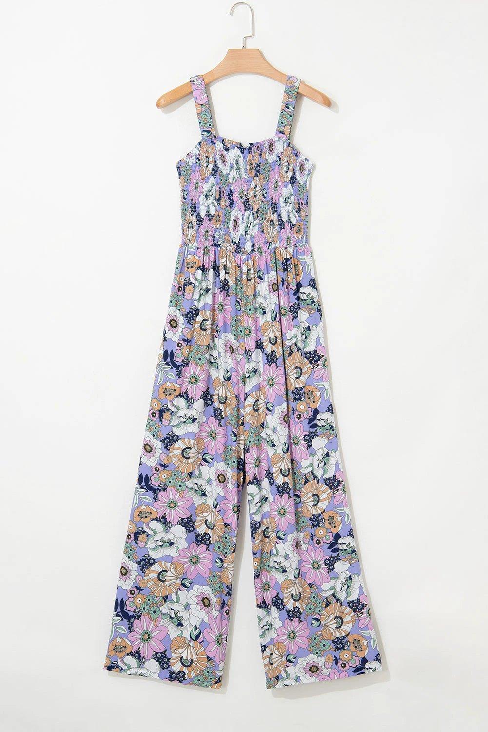 Boho Chic floral smocked square-neck jumpsuit with wide-leg silhouette and dark floral print