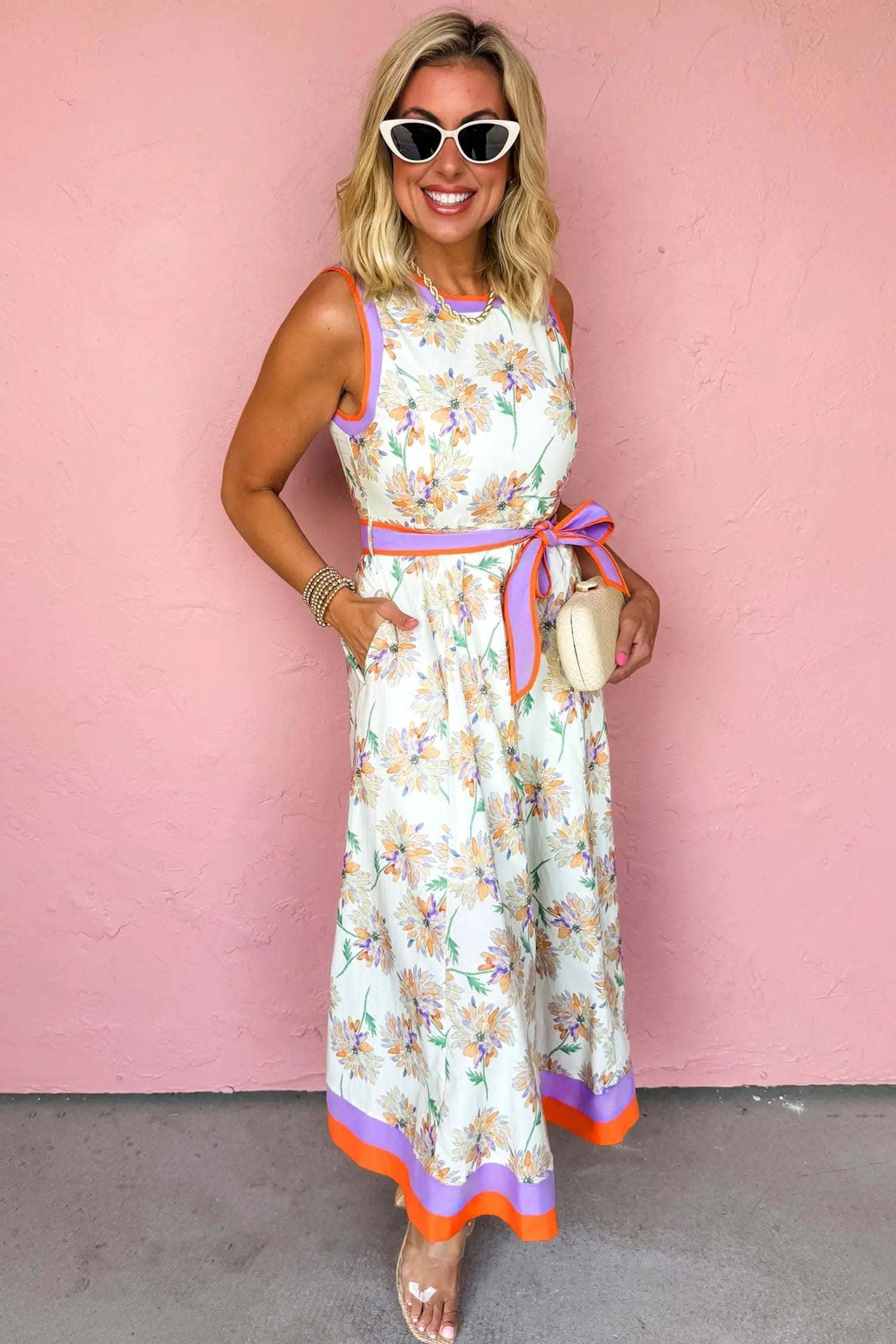 White floral print maxi dress with belted waist and color block trim outdoors