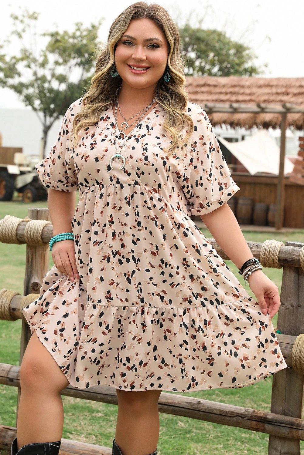 Plus size surplice floral print dress with V-neck and empire waist in beige