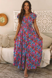 Woman wearing Main Character Energy floral print V-neck wrap maxi dress with split outdoors