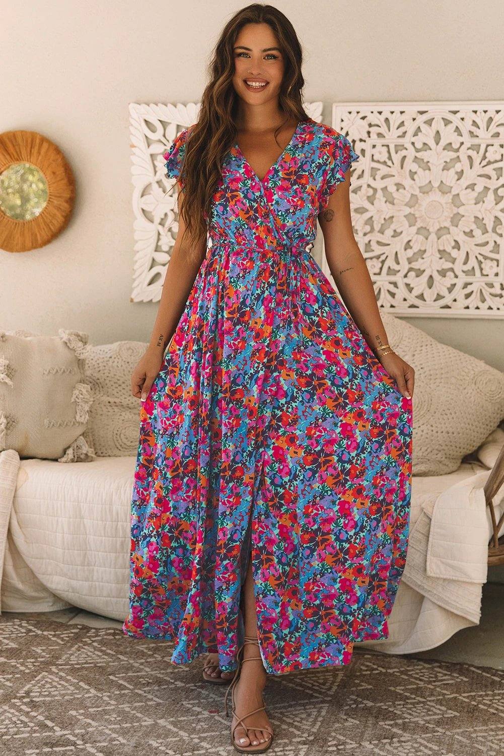 Woman wearing Main Character Energy floral print V-neck wrap maxi dress with split outdoors