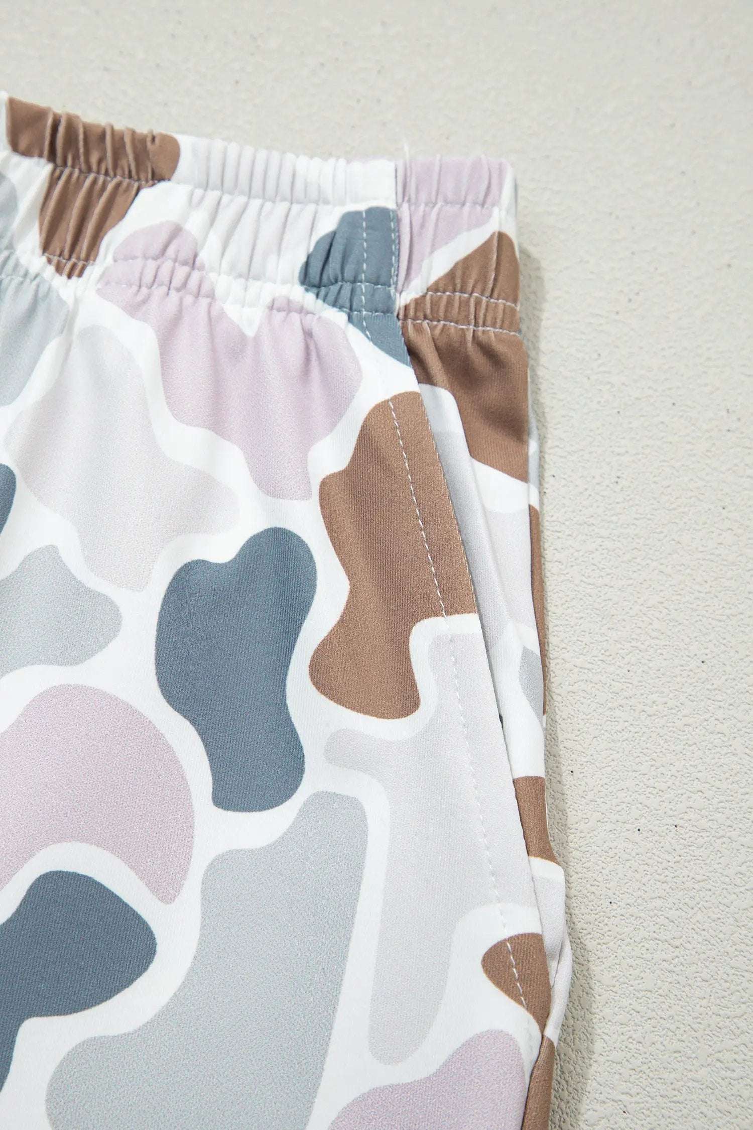 Woman wearing Cozy Confidence camouflage printed cropped tank and shorts set