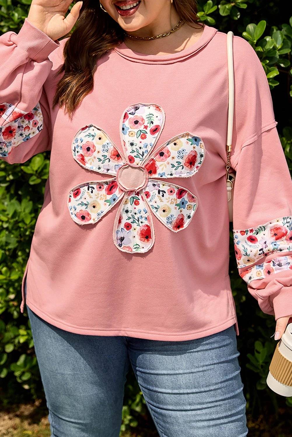 Plus size sweatshirt with peach blossom floral applique and drop shoulder for feel-good confidence