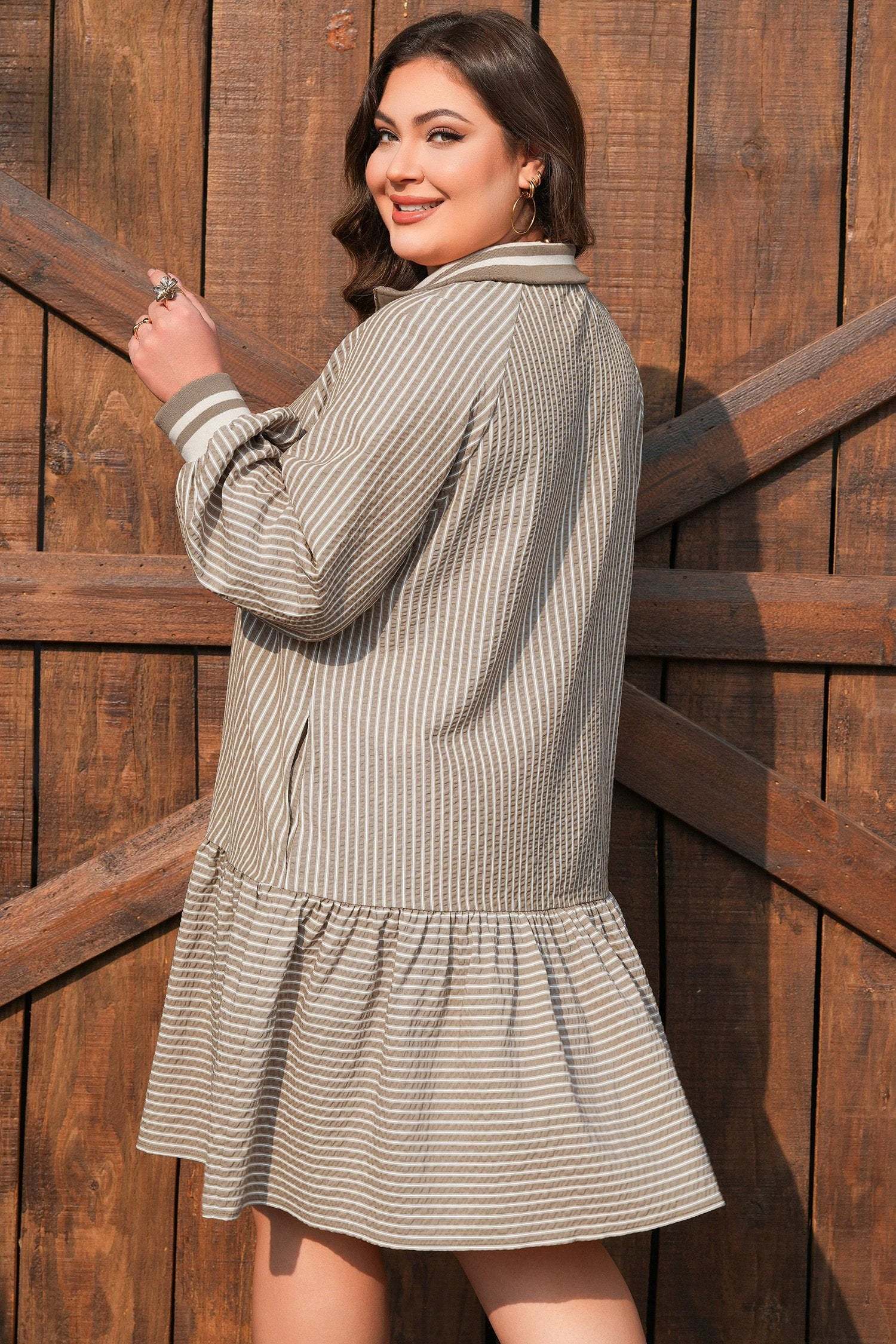 Plus size stripe puff sleeve mini dress with zip-front collar and ruffled hem embodying main character energy