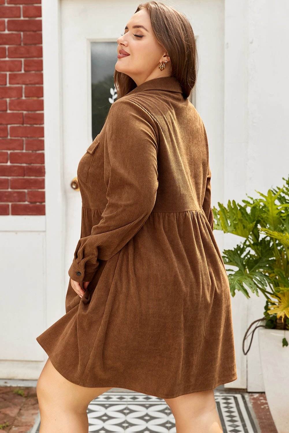 Plus size brown corduroy button-front shirt dress with collared neckline and chest pockets