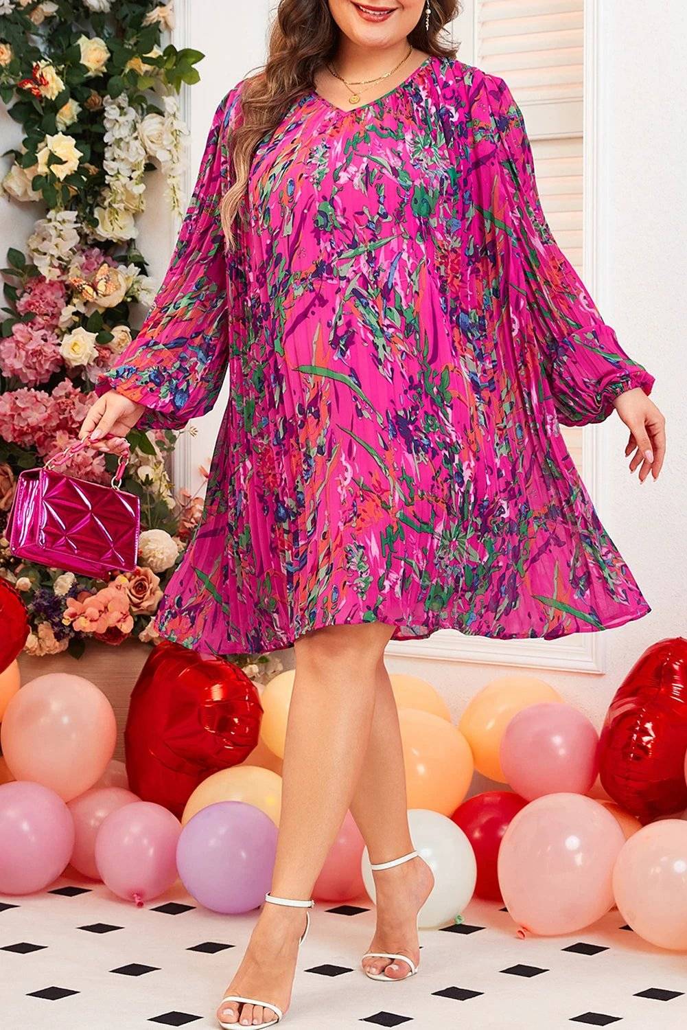 Plus size abstract floral print pleated dress with relaxed fit and vibrant colors