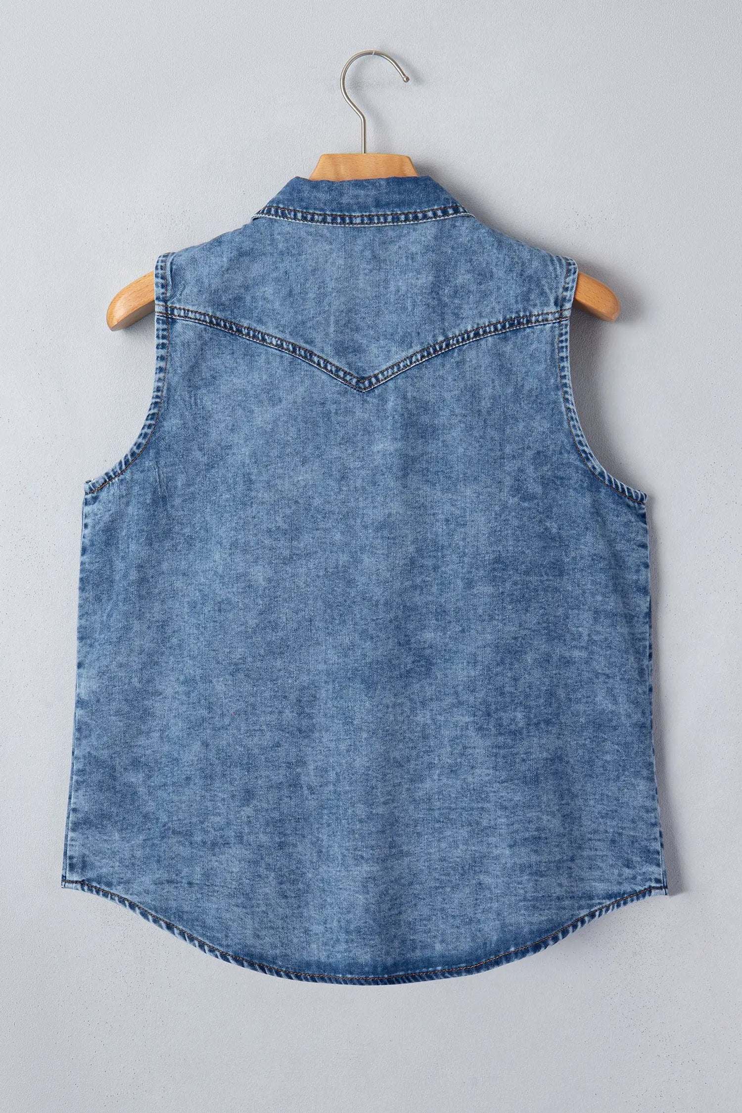 Sleeveless Western Chic denim top with button-front and collar in soft blue wash