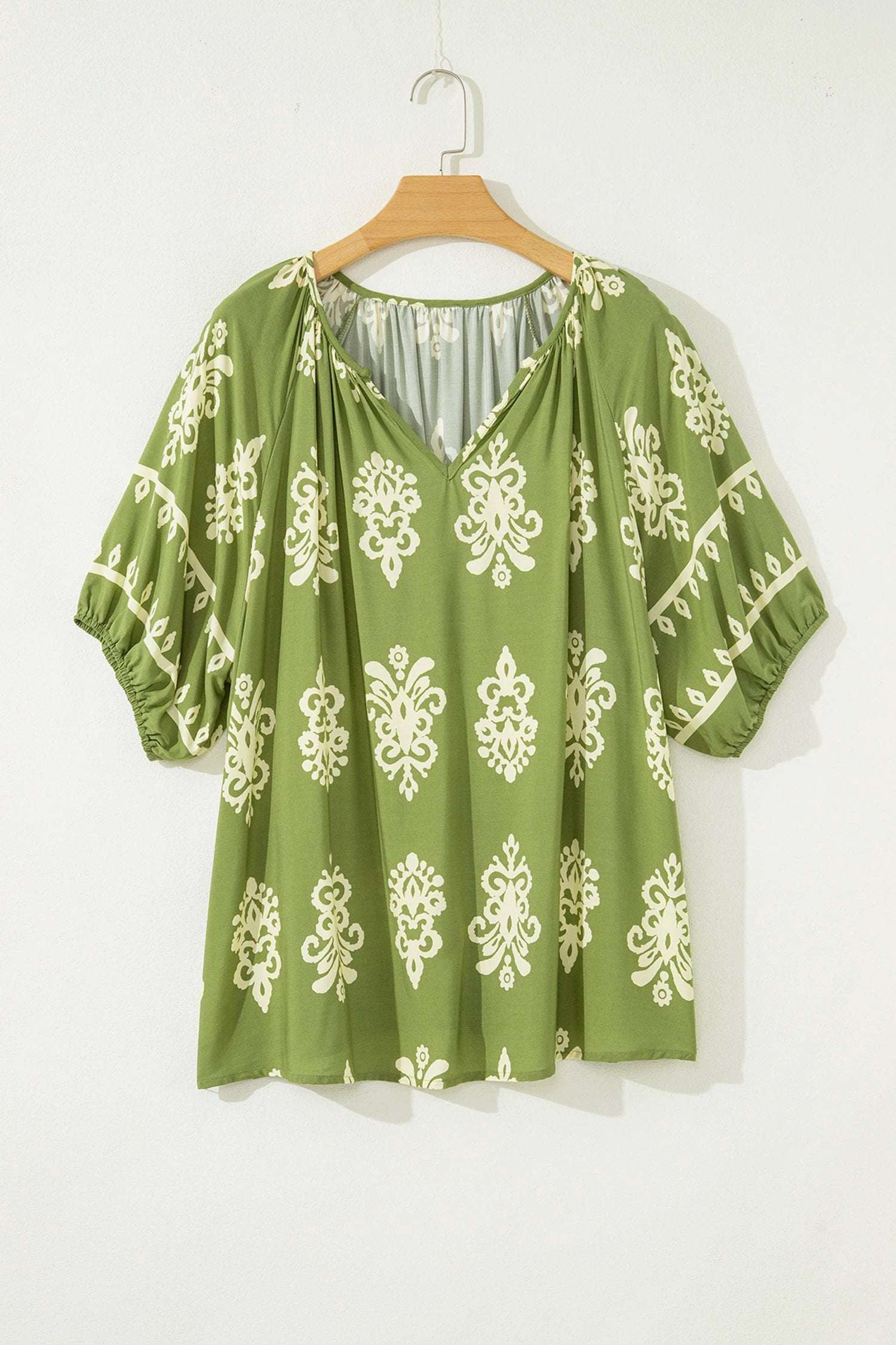Plus size effortless boho floral notched V neck short sleeve top in emerald green