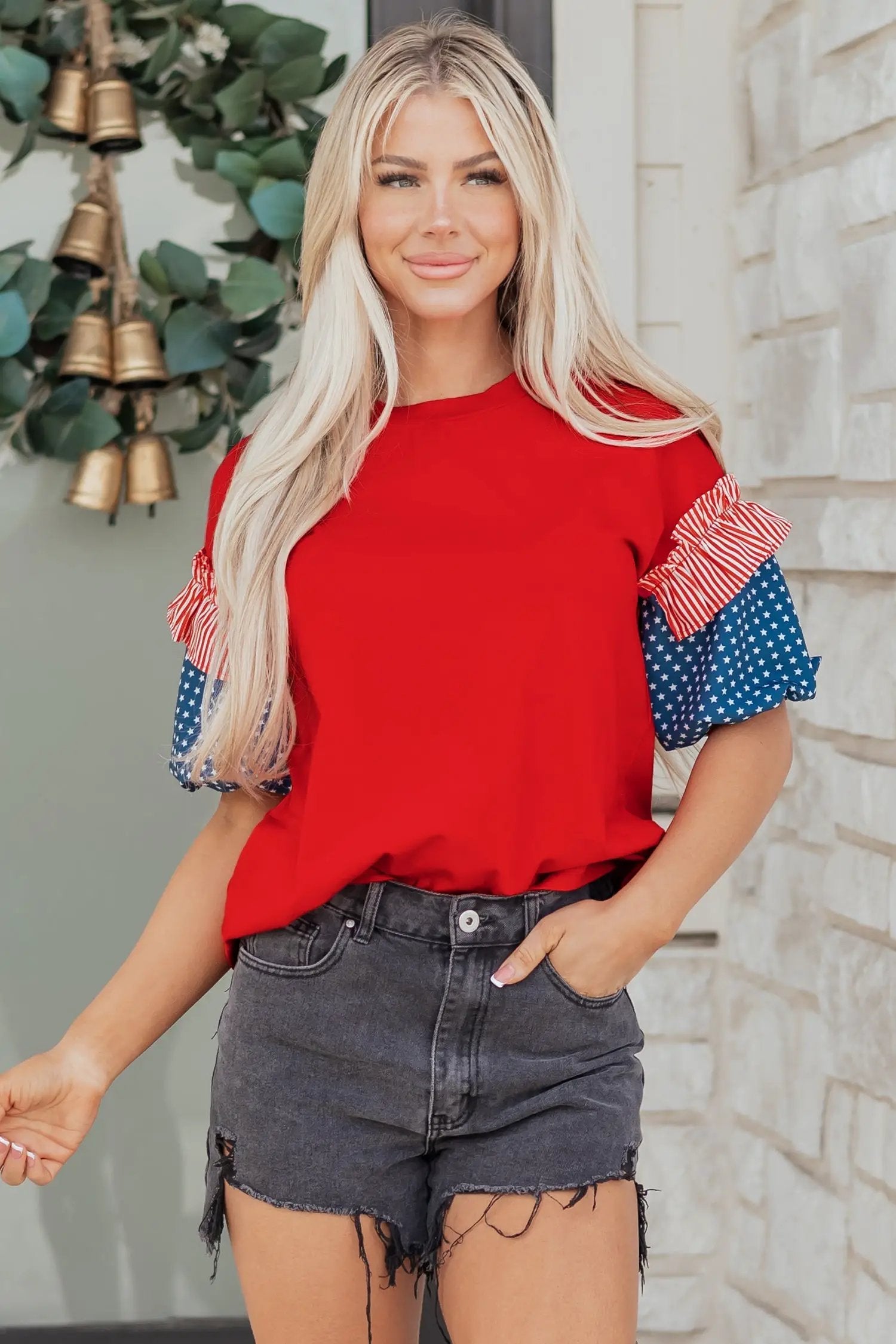 Sky-blue puff sleeve top with fiery red stars stripes and American flag print