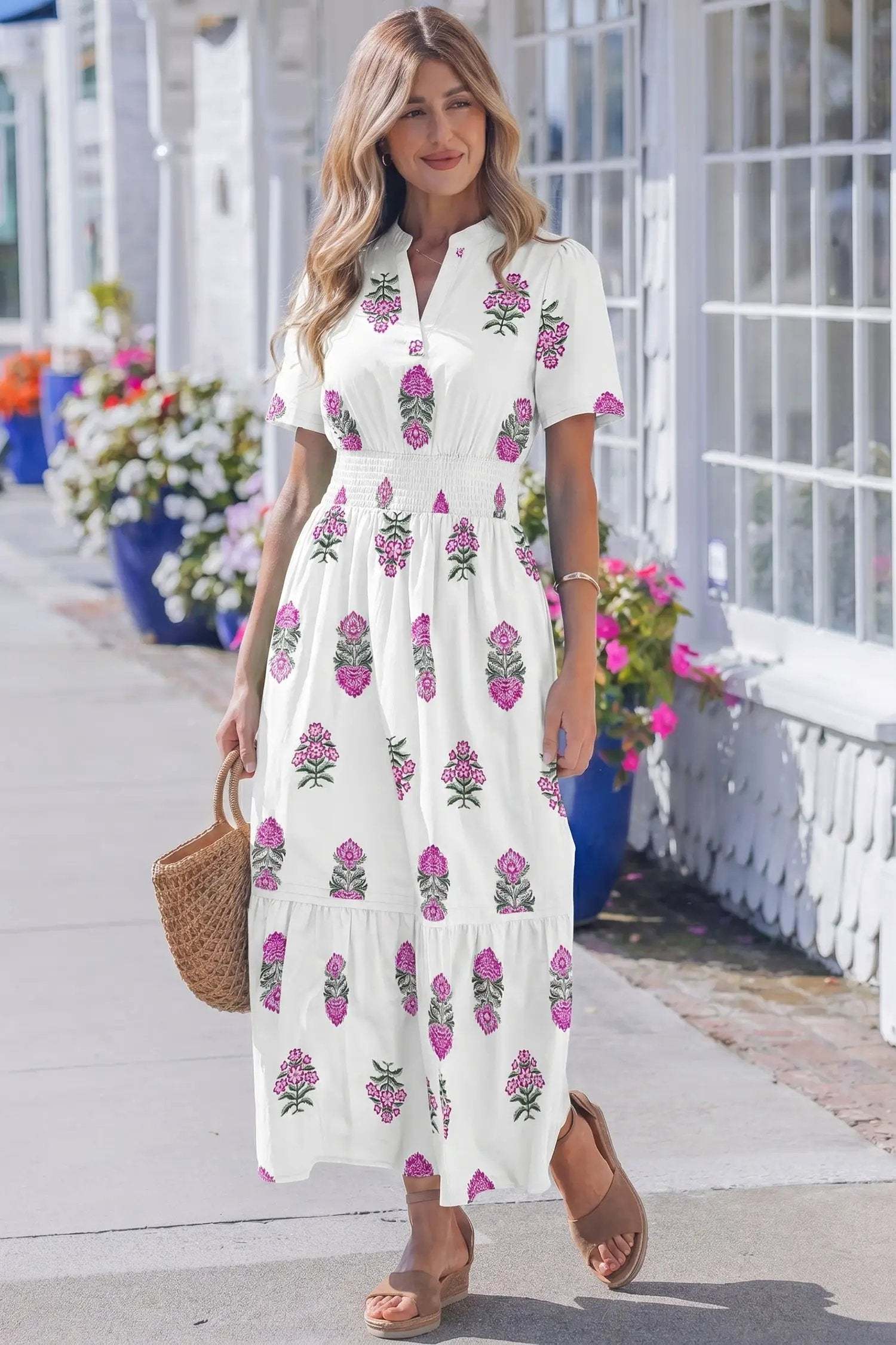 Woman wearing Main Character Energy floral print split neck maxi dress with shirred waist and ruffle hem