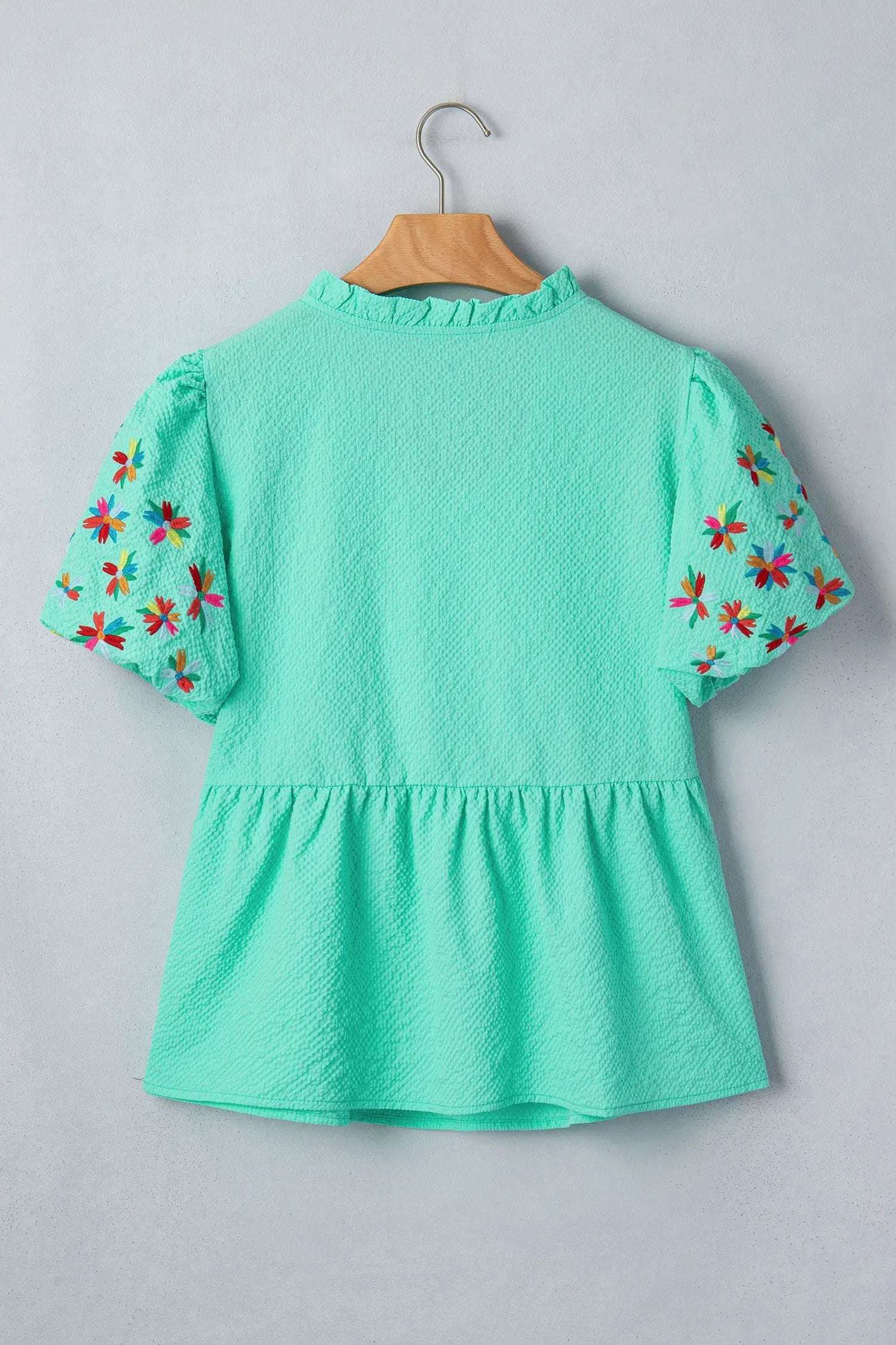 Lightweight floral embroidered blouse with V-neck and puff sleeves