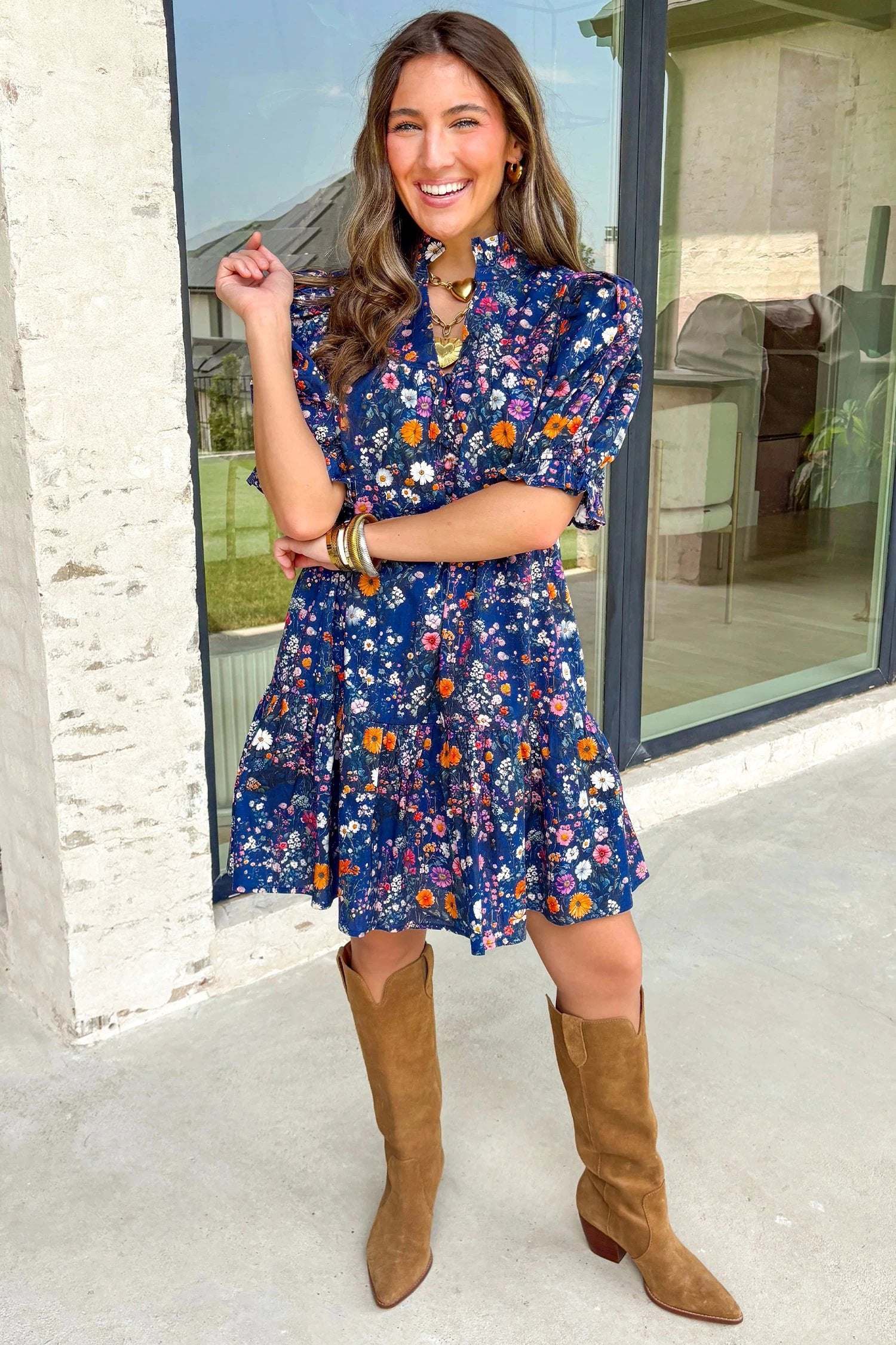 Navy floral puff-sleeve mini dress with wild daisy print and split-neck design