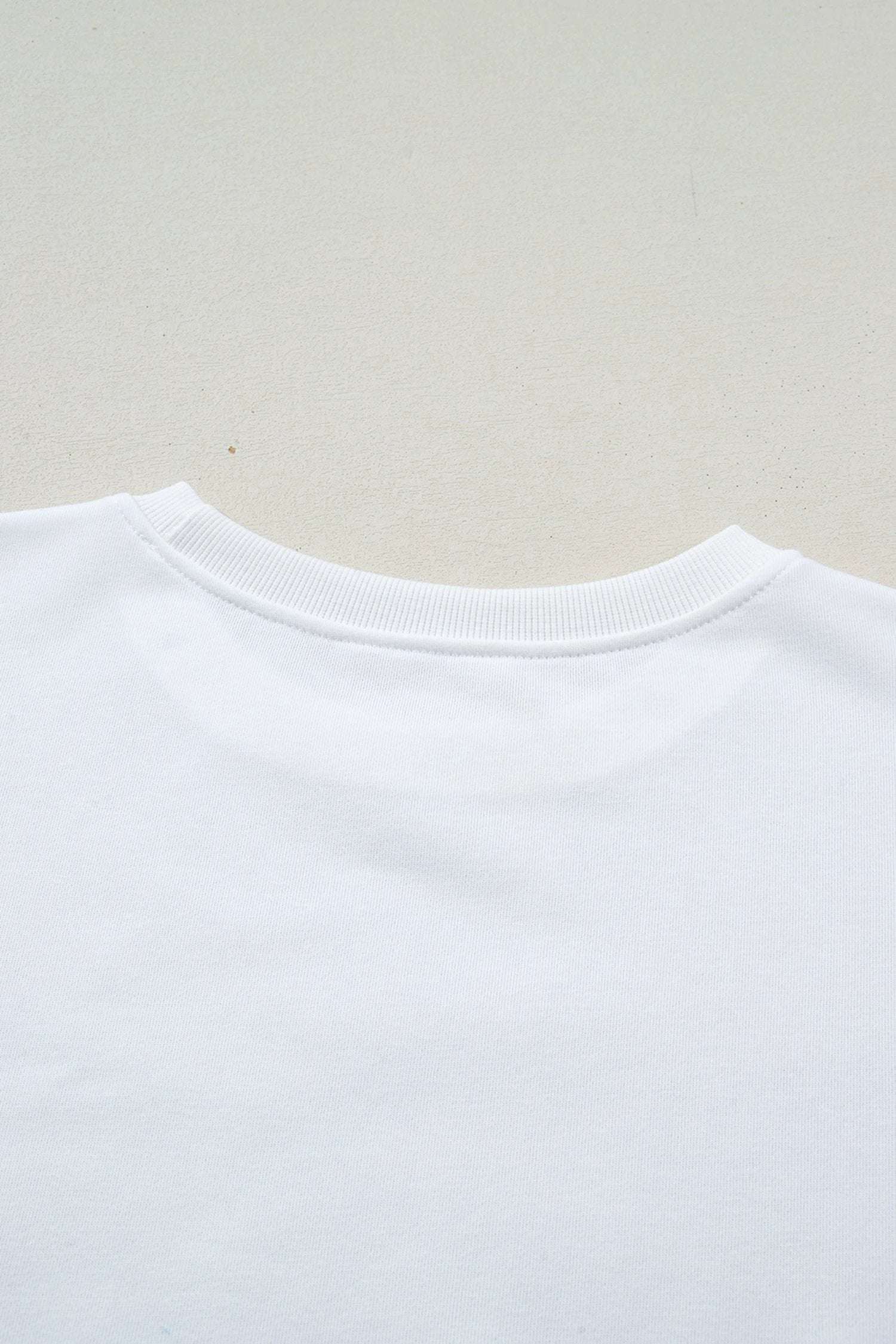 white solid color dropped shoulder long sleeve top for women casual everyday outfit