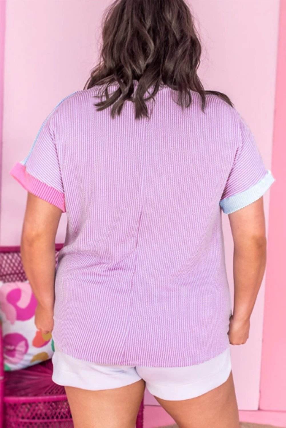 Plus size patchwork leopard corded knit tee with relaxed fit and colorblock panels