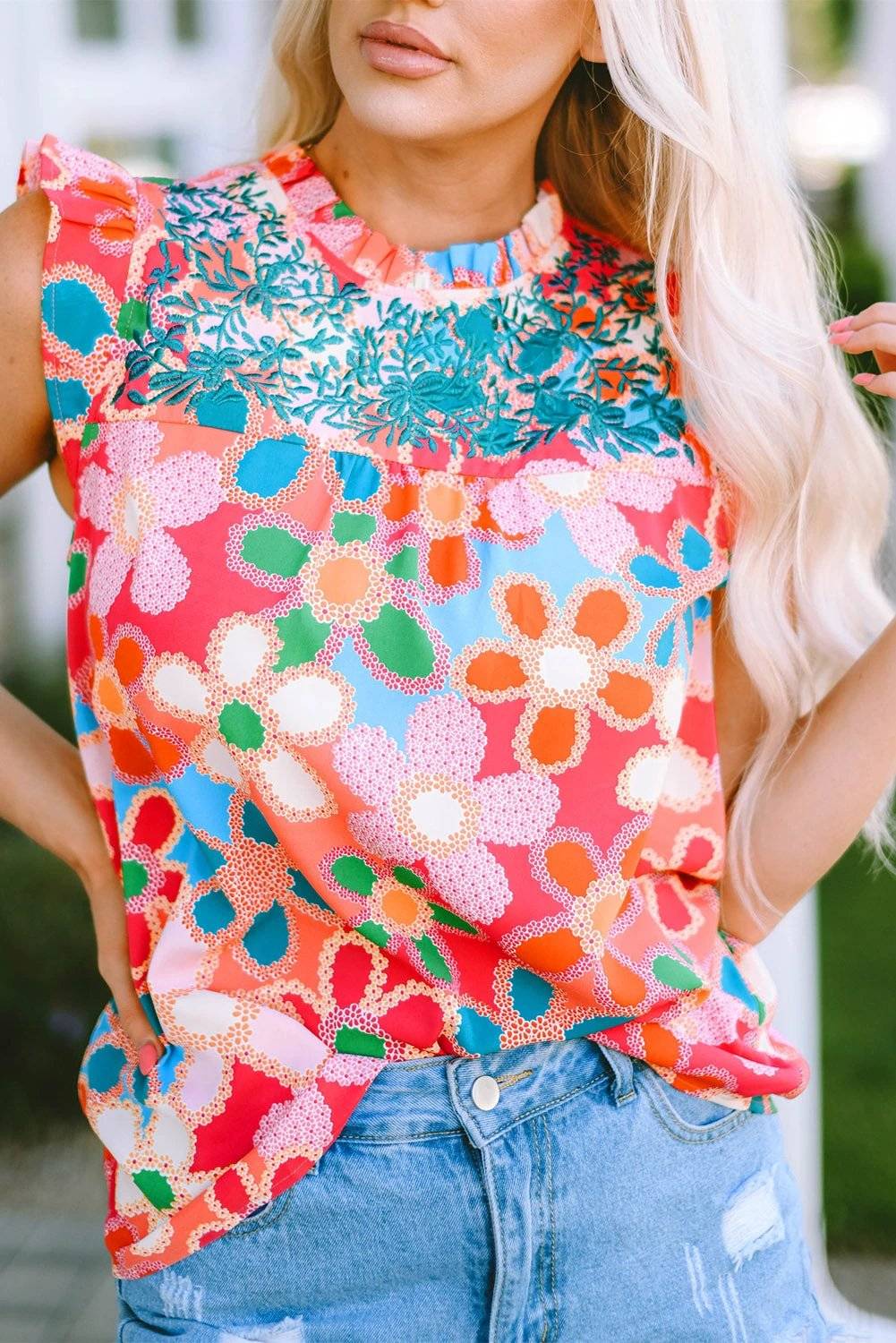 Pink embroidered floral print tank top with ruffle trim and sleeveless design