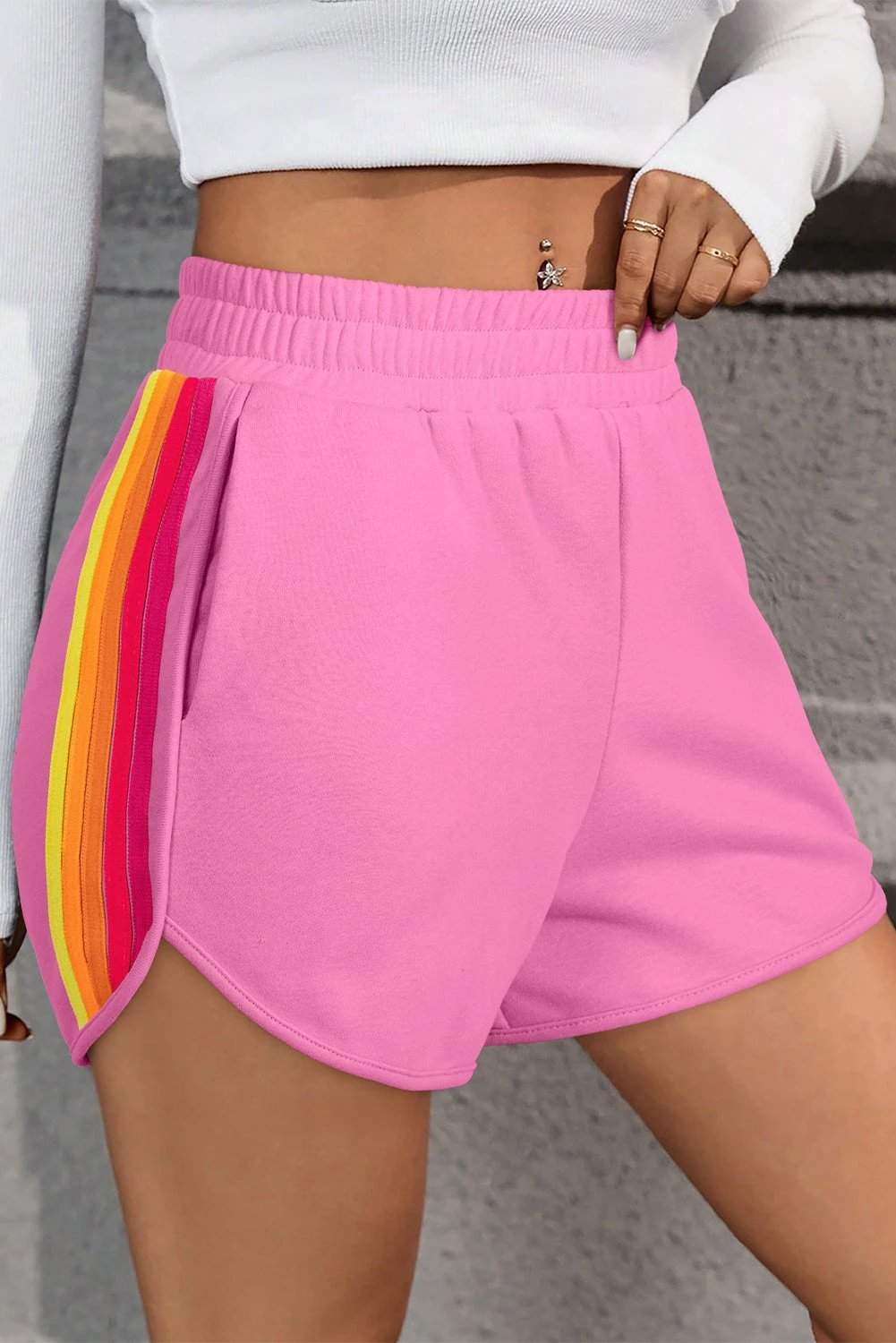 Pink high waist active shorts with colorful color block stripes on the sides