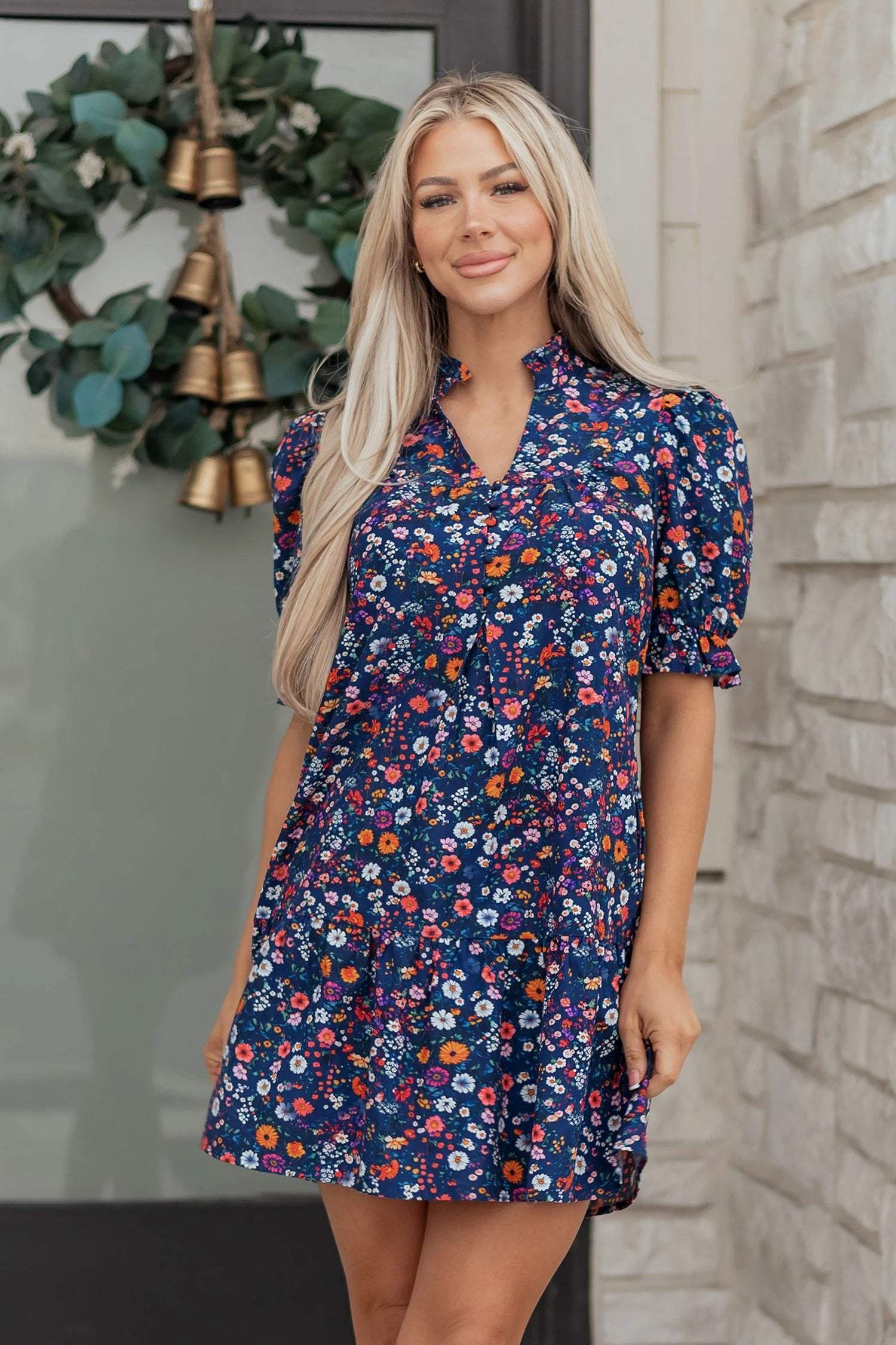 Navy mini dress with wild daisy floral print and puff sleeves