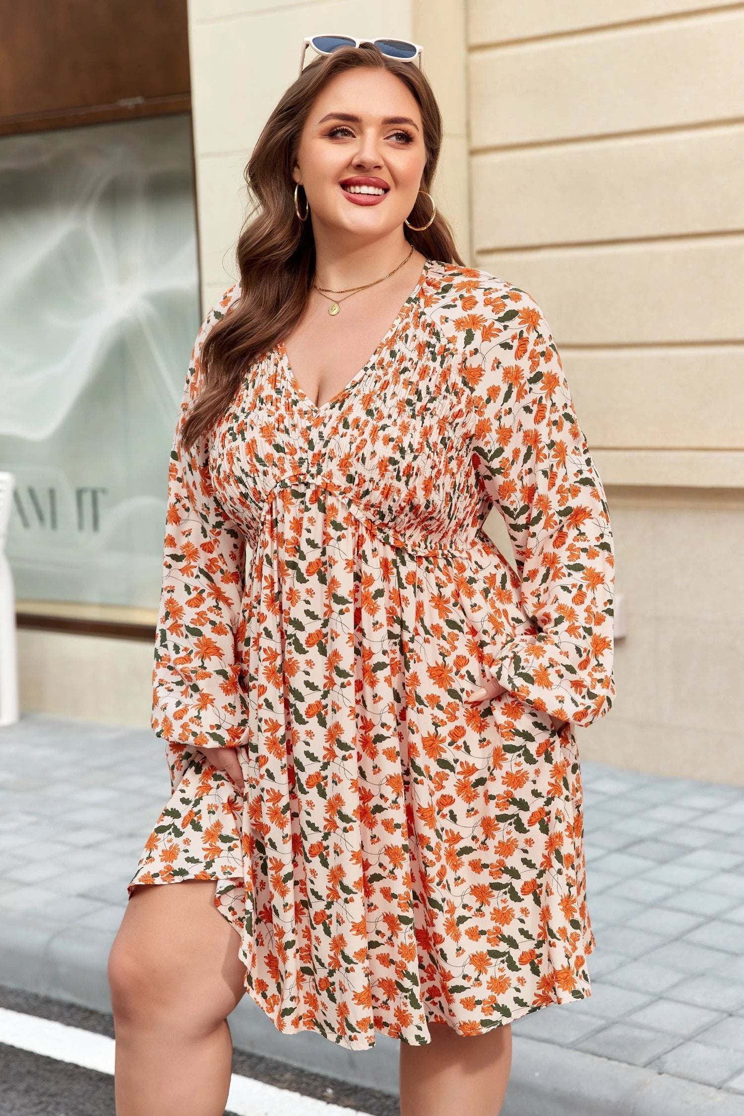 Plus size floral print V-neck long sleeve babydoll mini dress in orange and cream