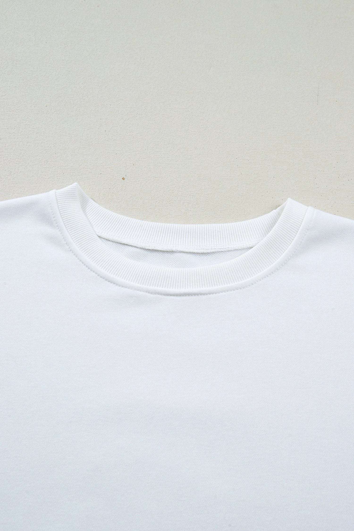 white solid color dropped shoulder long sleeve top for women casual everyday outfit