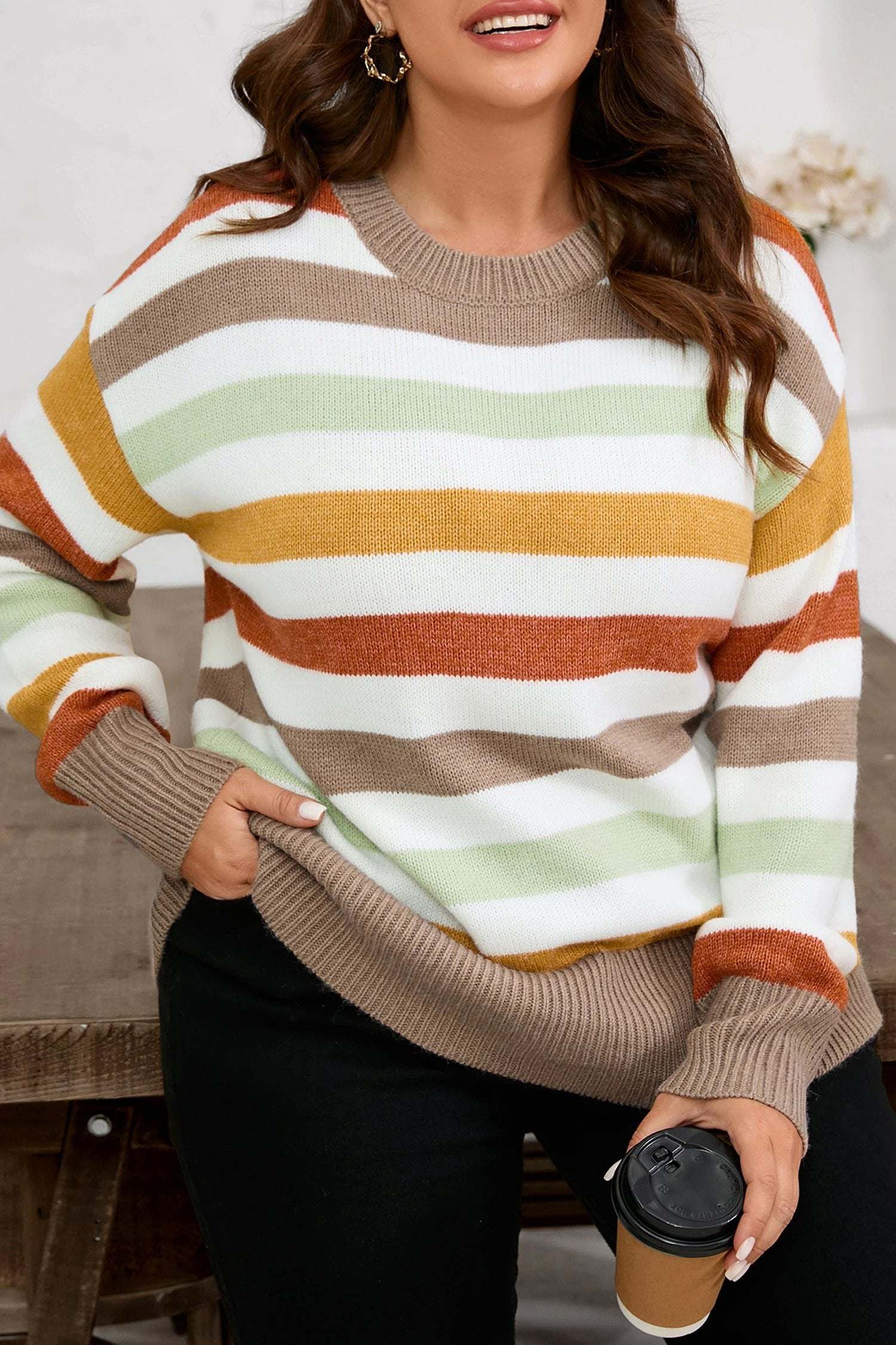 Plus size striped colorblock drop shoulder sweater in earthy tones on model