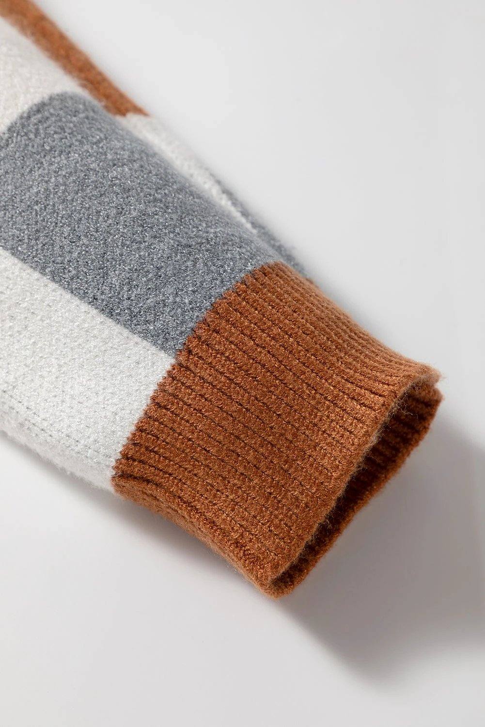Plus size checkered crewneck sweater with brown, white, and gray pattern in relaxed fit and ribbed cuffs