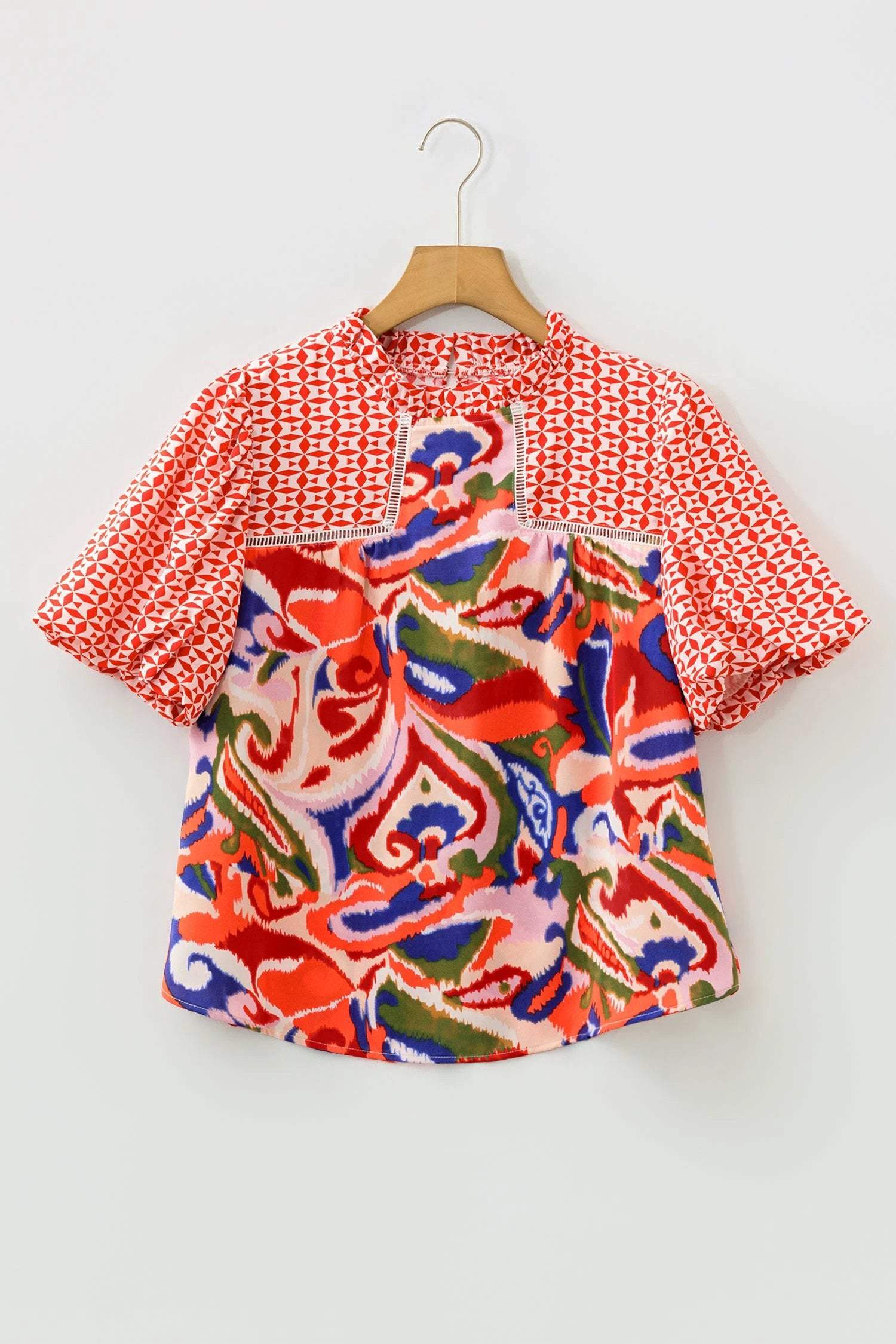 Woman wearing effortless boho chic paisley geometric puff sleeve blouse top