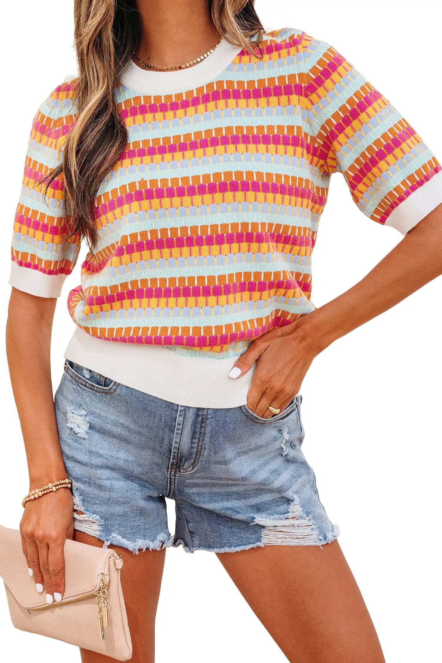 Orange striped knit sweater with abstract stripes and fuchsia pink ribbed neckline