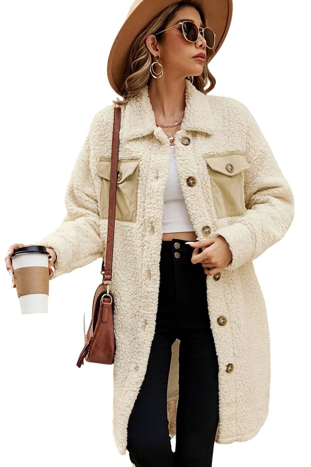 Single-breasted teddy fleece coat with plush texture and navy contrast flap pockets