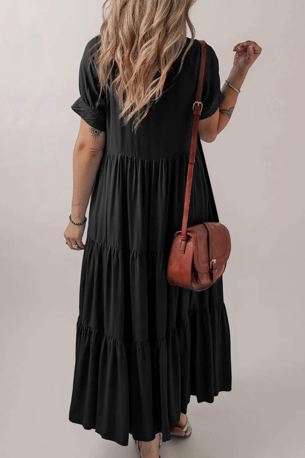 Black tiered ruffle maxi dress with hidden buttons and short sleeves