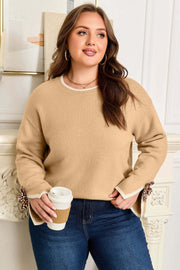 Plus size relaxed fit sweater with leopard bow decor on split cuffs and beige knit fabric