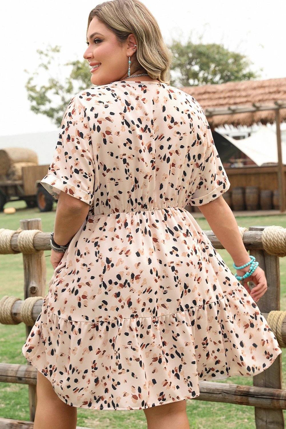 Plus size surplice floral print dress with V-neck and empire waist