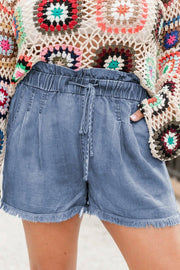 Plus size dusk blue raw hem denim shorts with lace-up high waist and stretch fabric