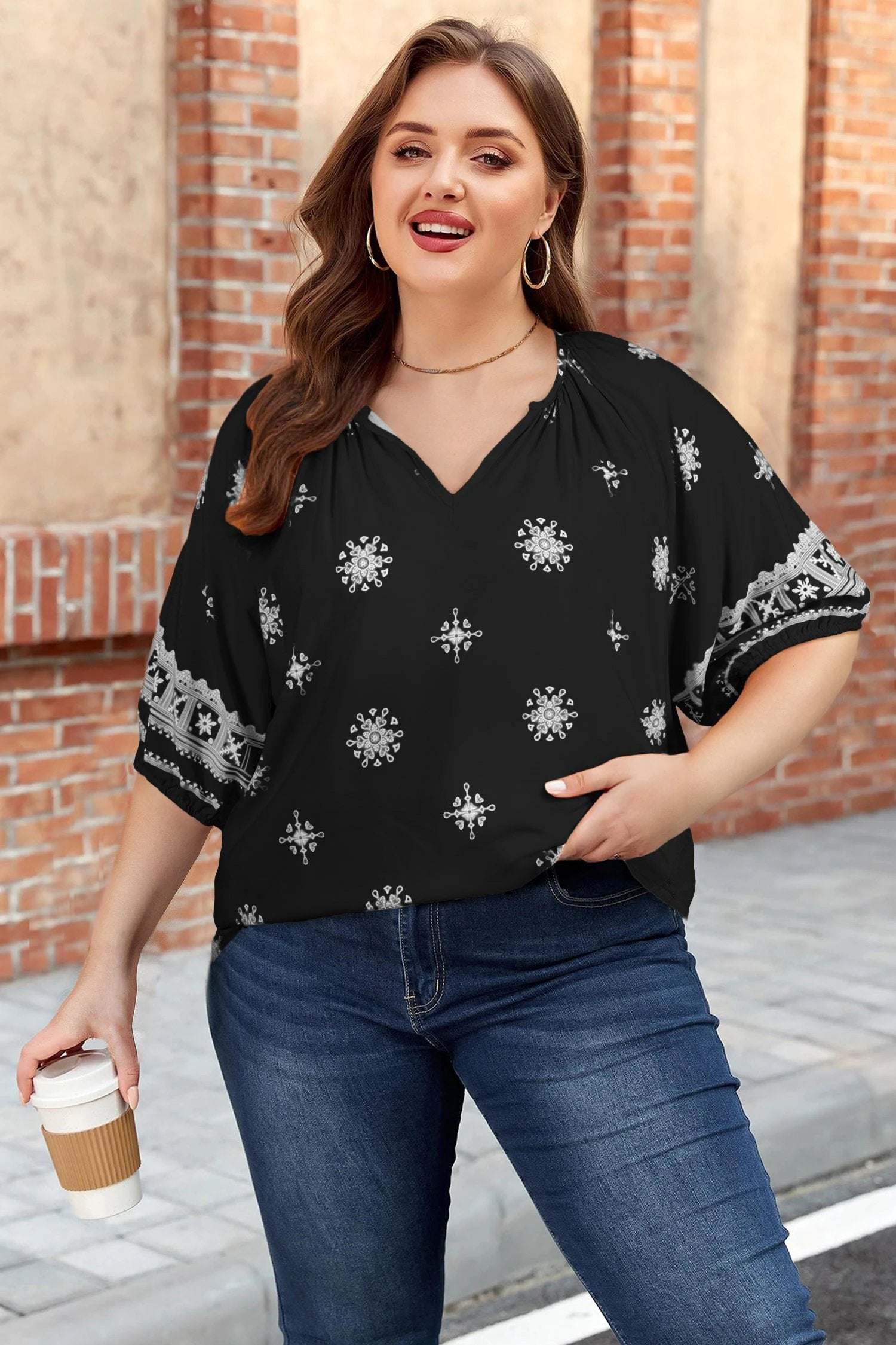 Plus size floral top with notched V-neck and short sleeves in emerald green Effortless Boho style