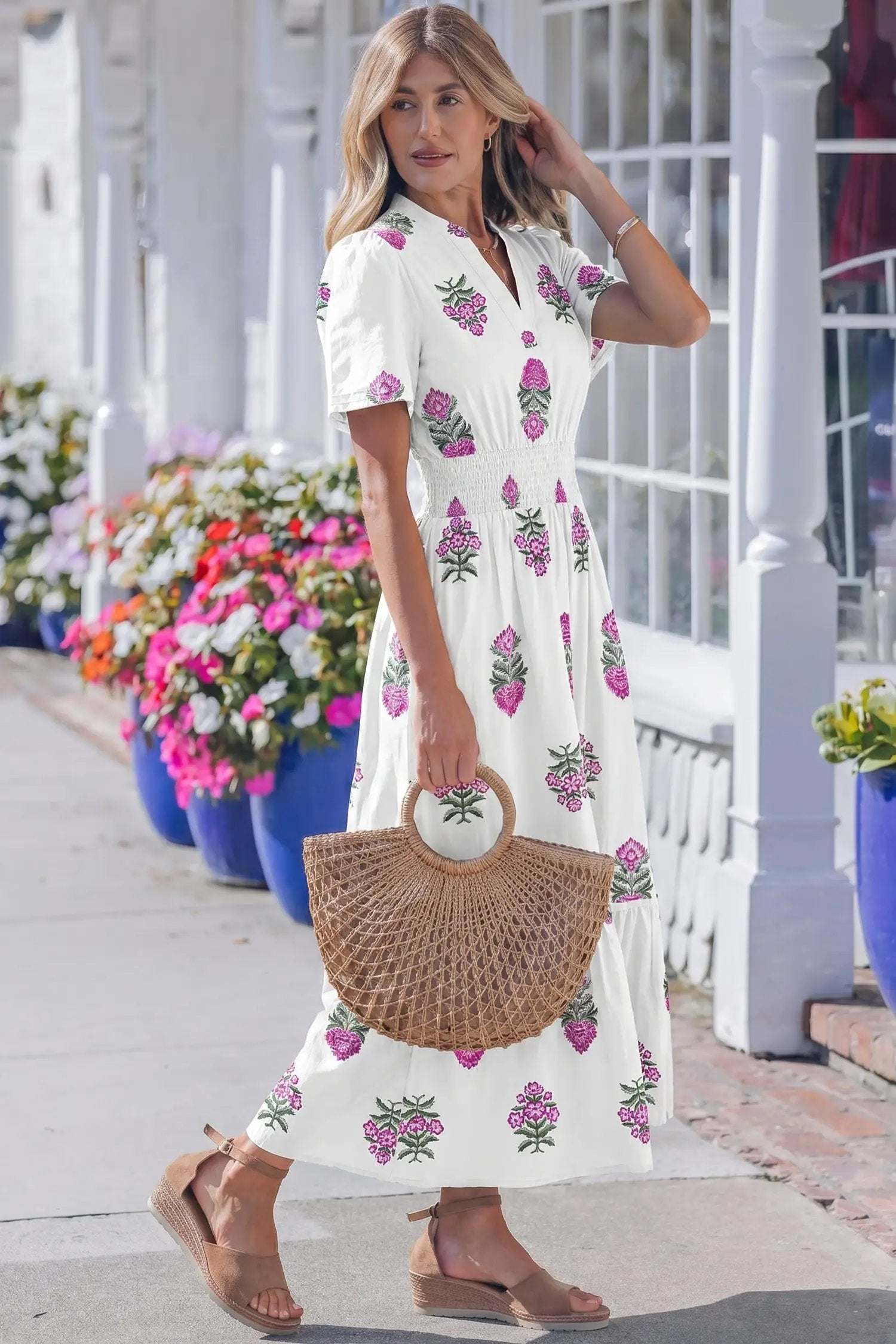 Woman wearing floral print split neck maxi dress with shirred waist and ruffle hem, embodying main character energy