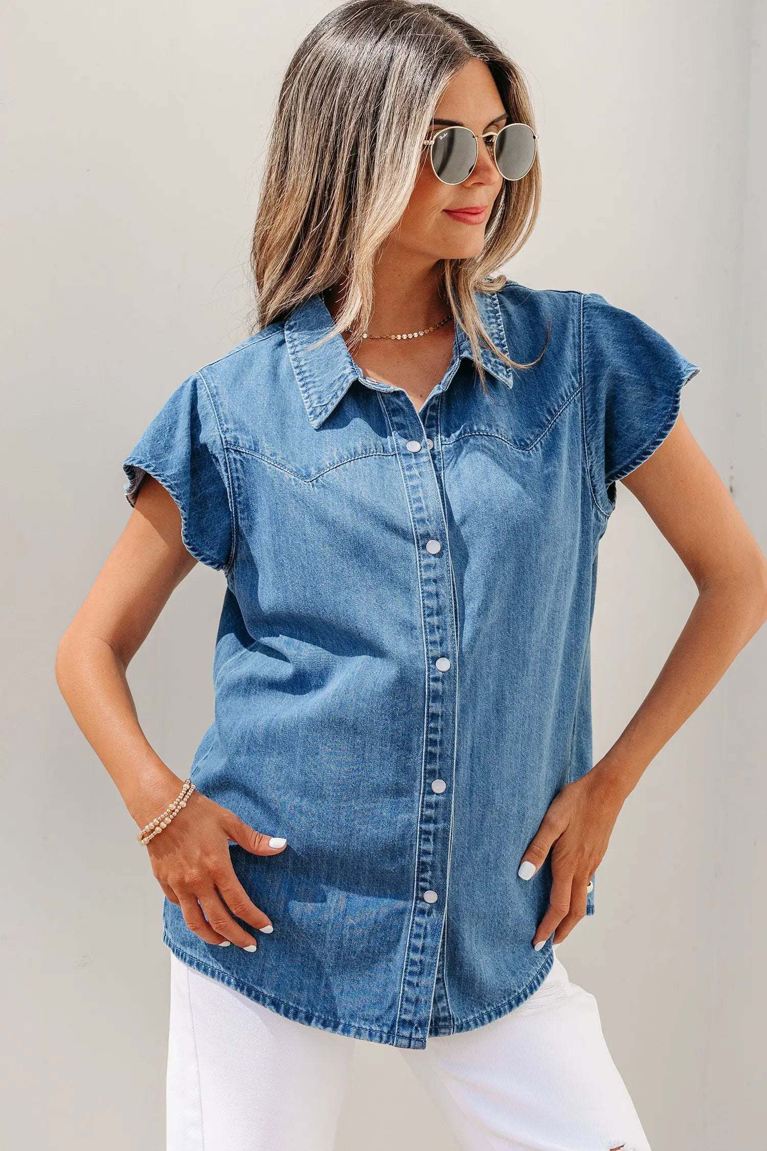 Denim ruffled short sleeve shirt with button front and flutter sleeves in classic blue denim